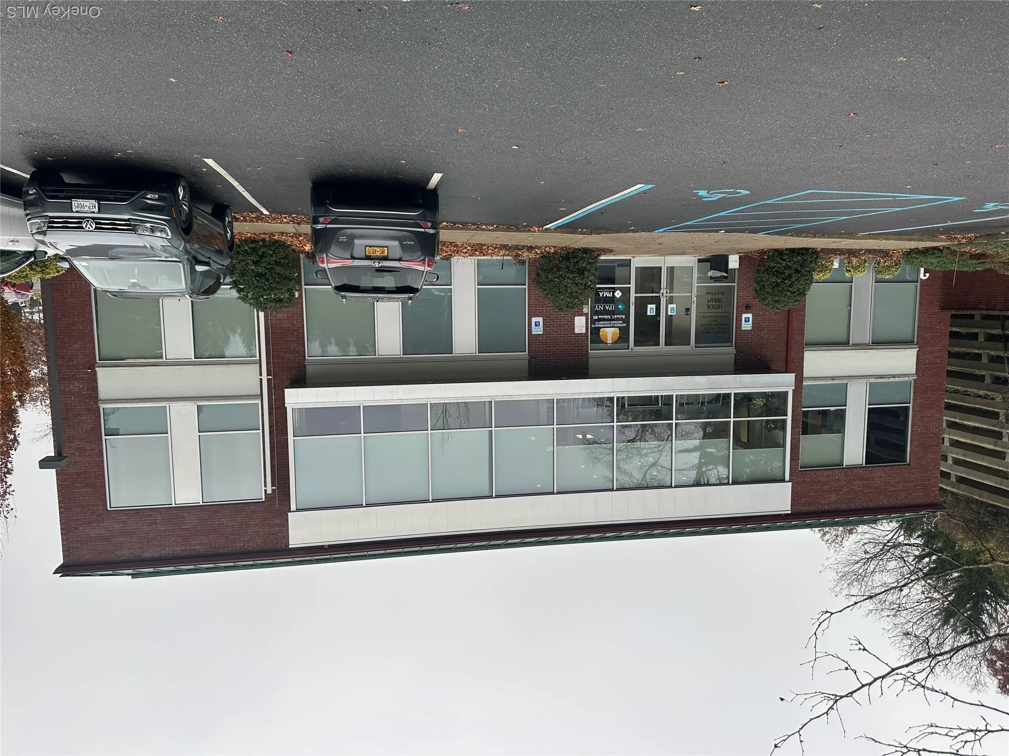 View of apartment building / complex with uncovered parking View of apartment building / complex with uncovered parking