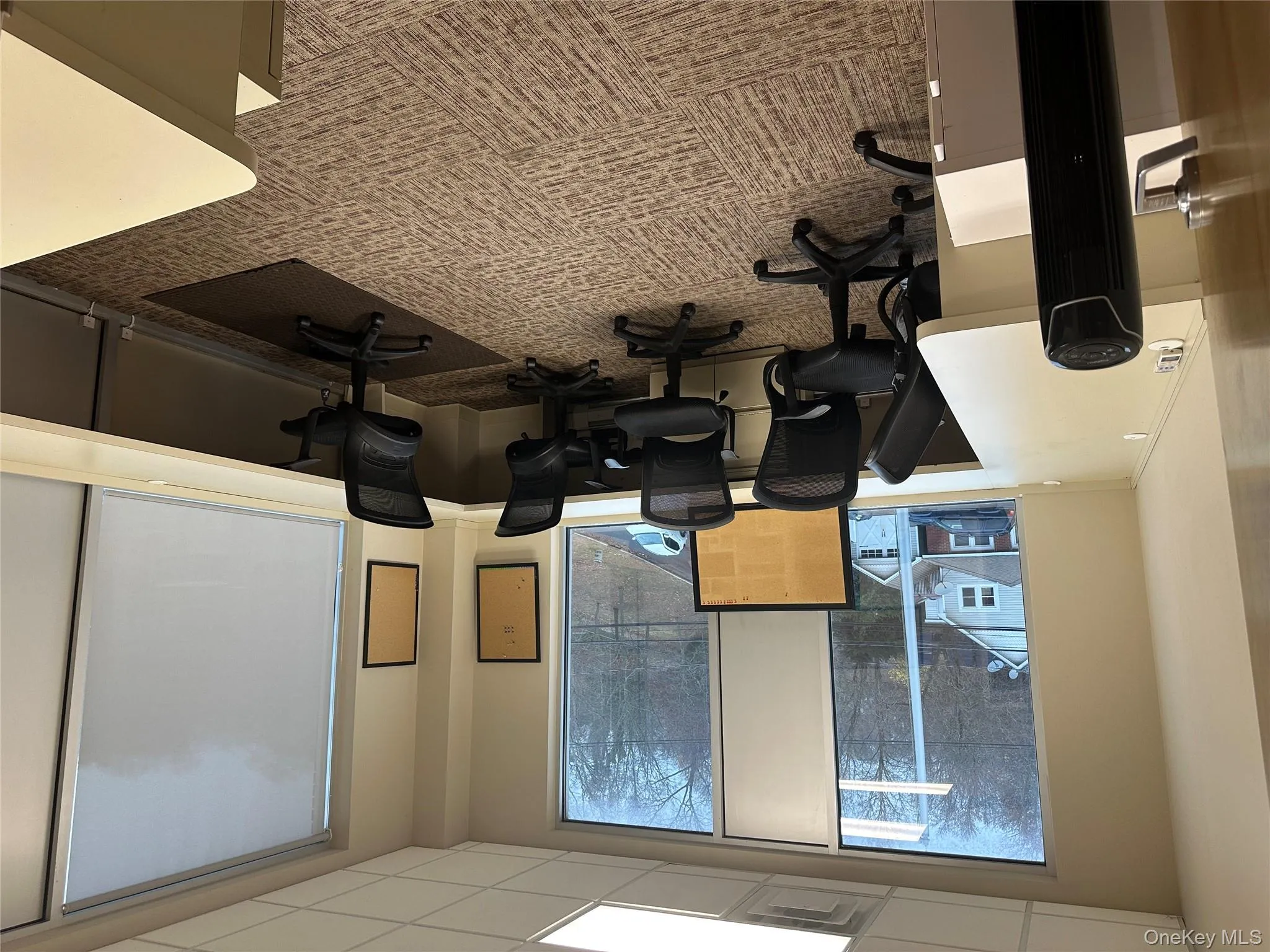 Office with a paneled ceiling Office with a paneled ceiling