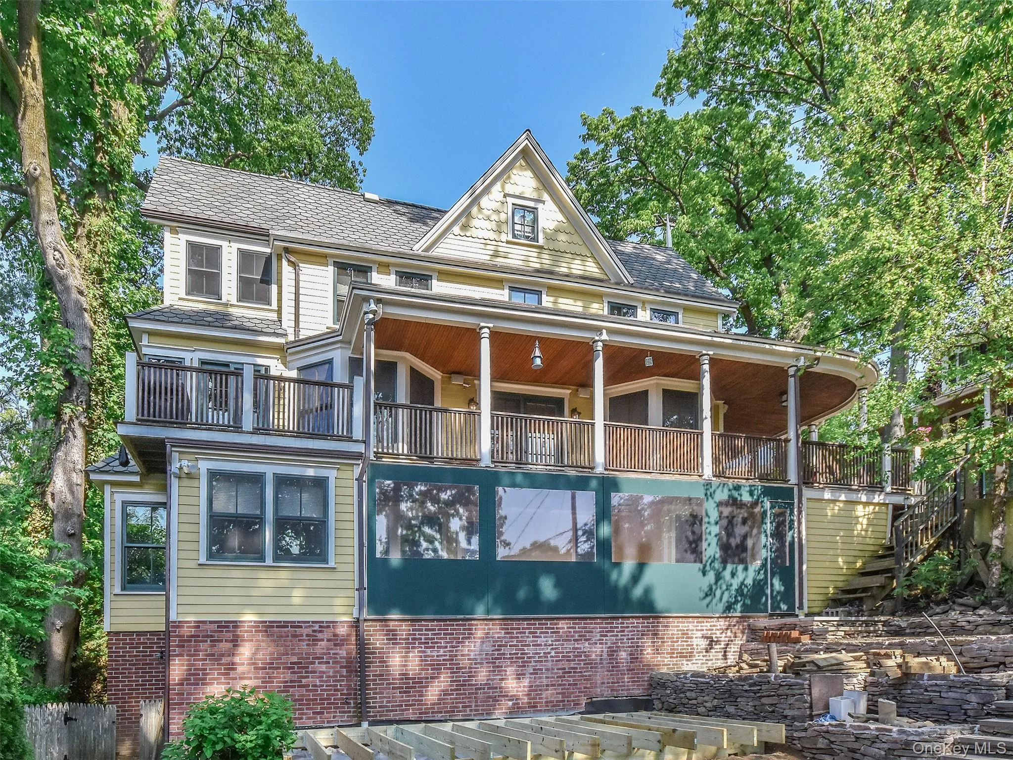 View of side of home with wrap around deck and enclosed deck below View of side of home with wrap around deck and enclosed deck below