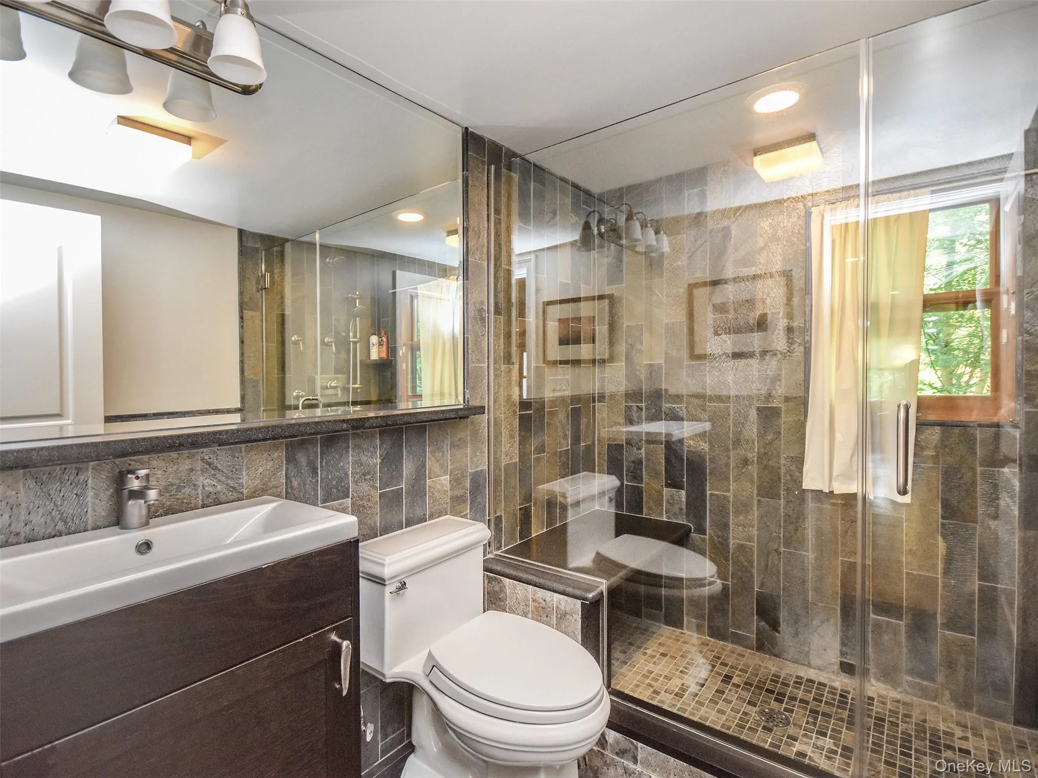 3rd Full bathroom with tile walls, vanity, a stall shower, and recessed lighting 3rd Full bathroom with tile walls, vanity, a stall shower, and recessed lighting