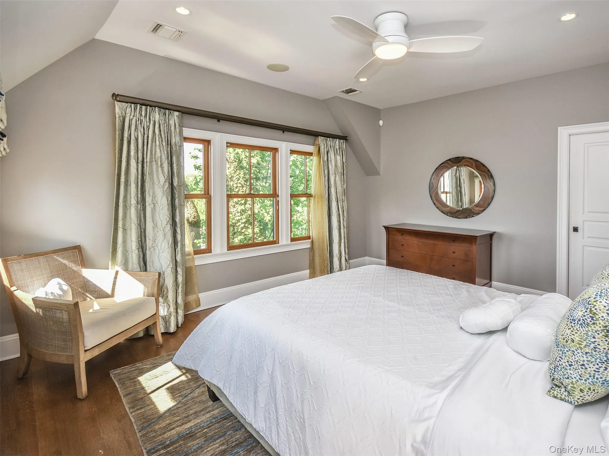 Primary Bedroom with wood finished floors, a ceiling fan, recessed lighting, and lofted ceiling Primary Bedroom with wood finished floors, a ceiling fan, recessed lighting, and lofted ceiling