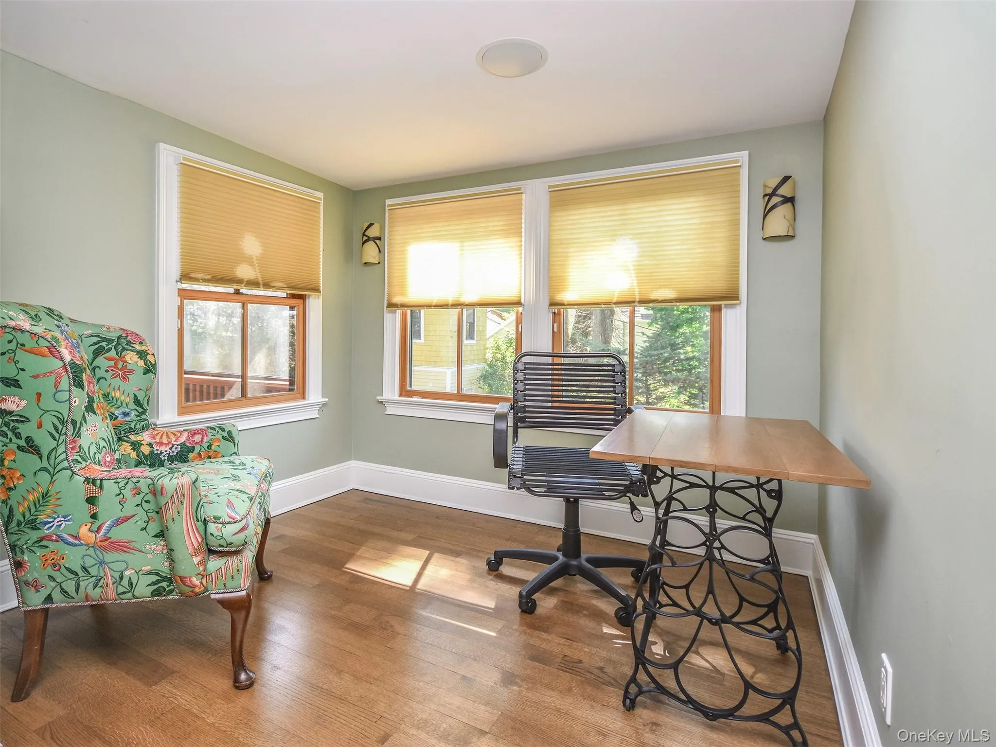 Small bedroom or office area featuring hardwood / wood-style floors and healthy amount of natural light Small bedroom or office area featuring hardwood / wood-style floors and healthy amount of natural light