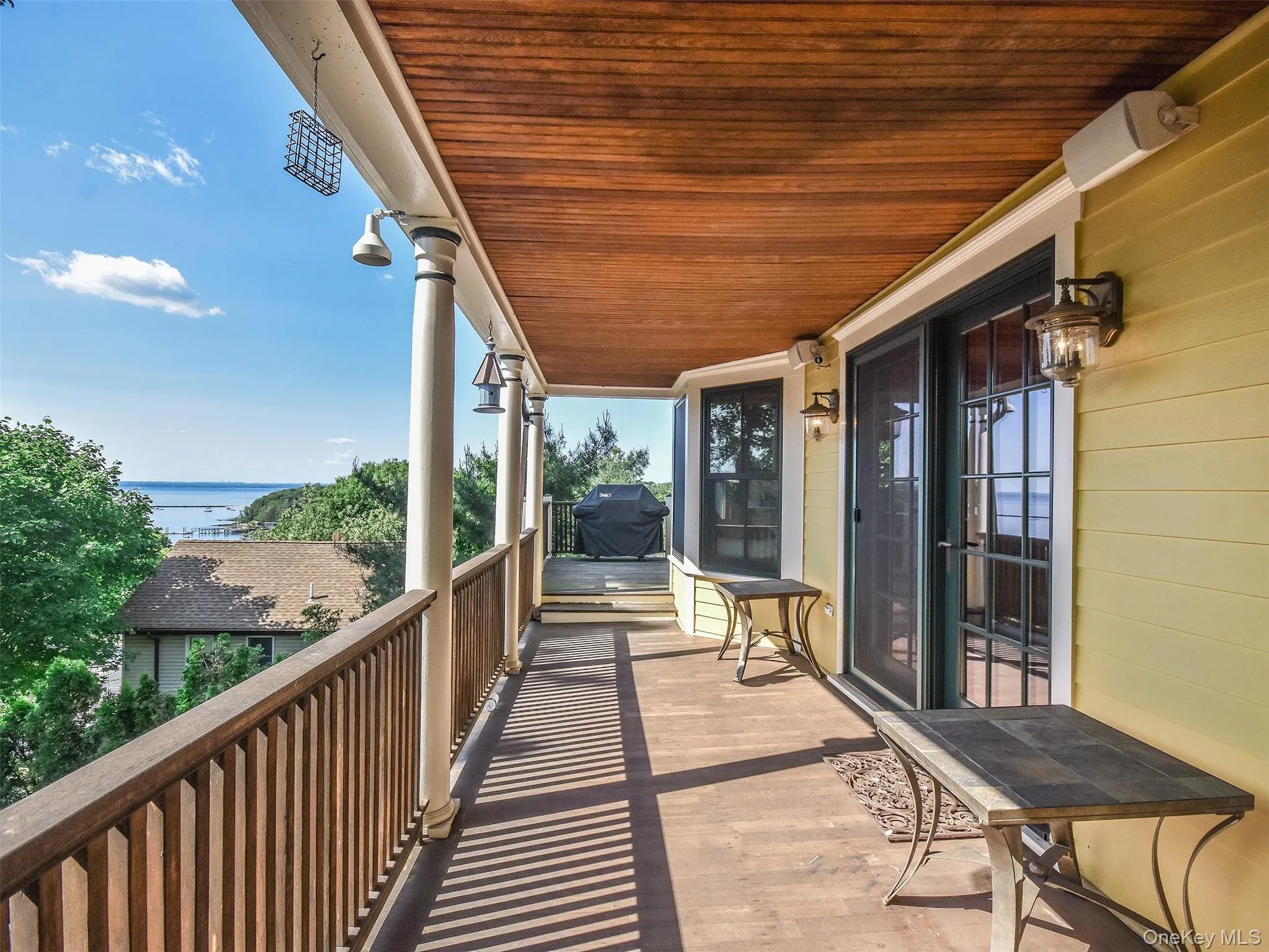 Wrap around porch featuring a water view and French doors off the the living room leading to the wrap around Wrap around porch featuring a water view and French doors off the the living room leading to the wrap around