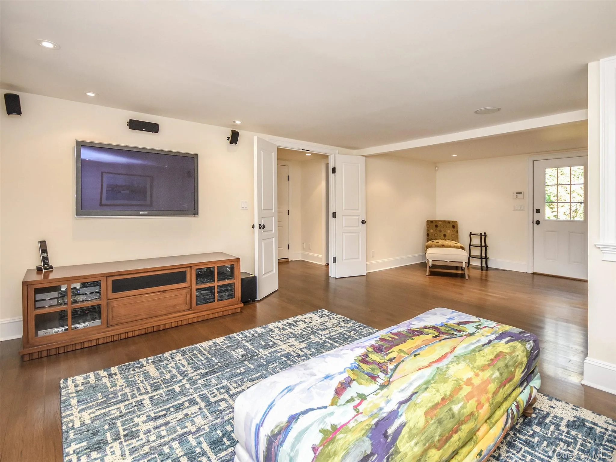 Lower Level: Den featuring TV media area. Lower Level: Den featuring TV media area.