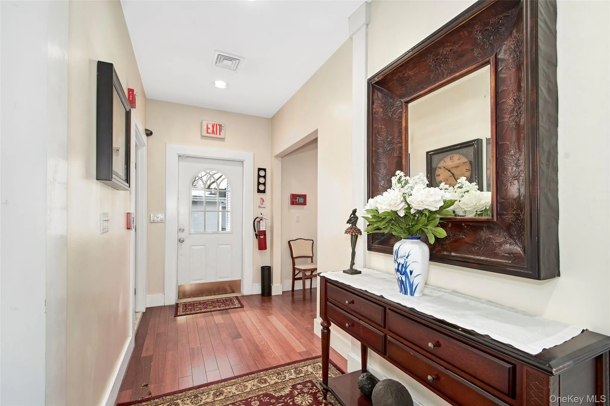 Back entrance leading to parking lot and detached garage Back entrance leading to parking lot and detached garage