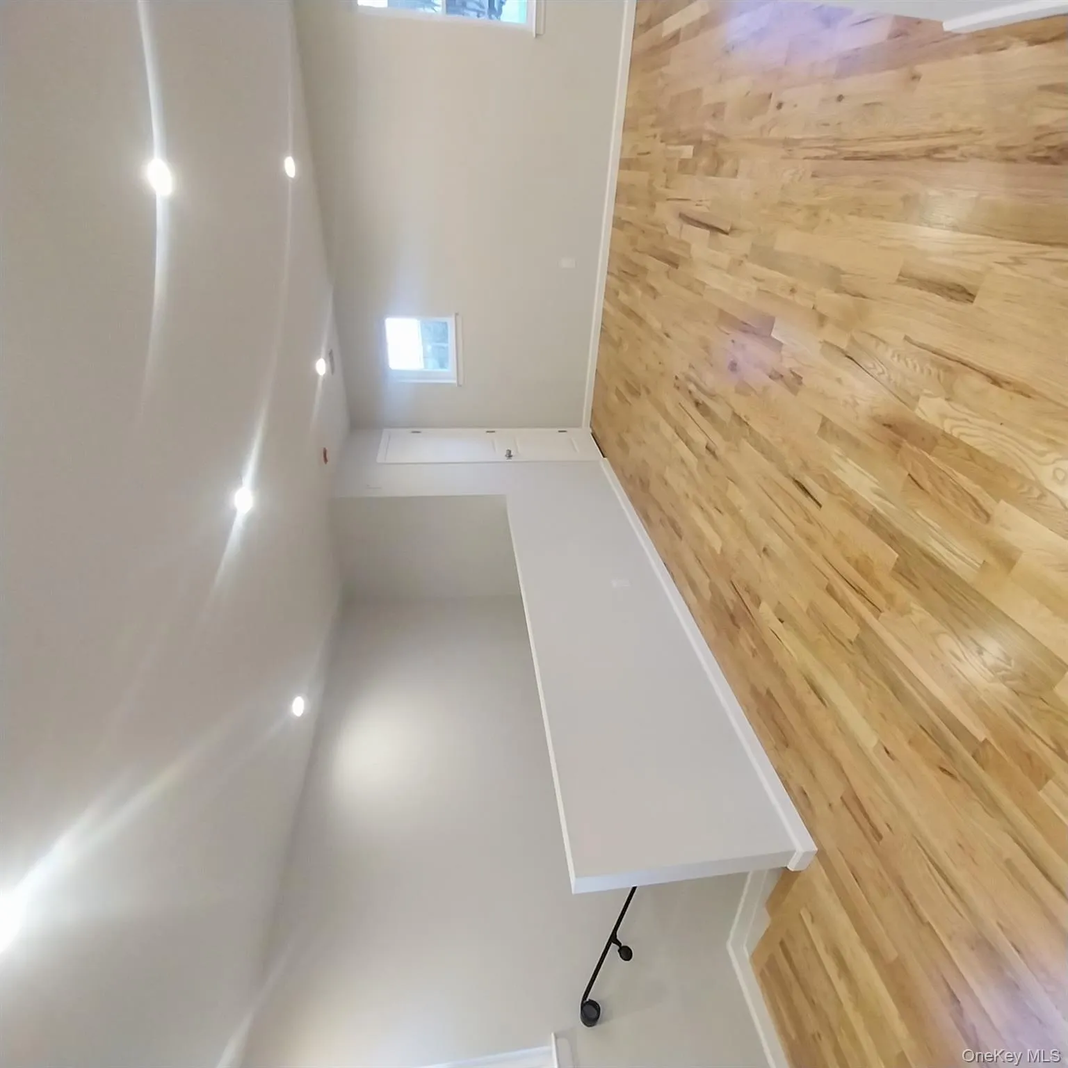 Below grade area featuring light wood-type flooring and recessed lighting Below grade area featuring light wood-type flooring and recessed lighting