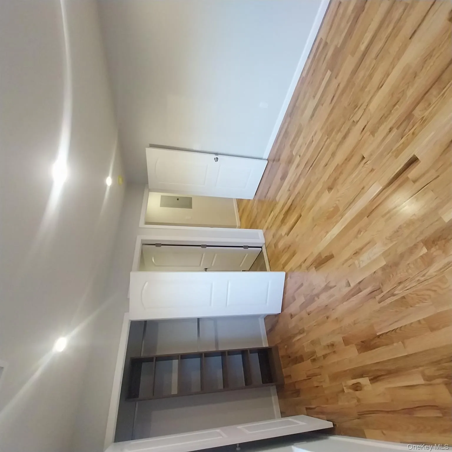Unfurnished bedroom featuring light wood-style flooring, a closet, and recessed lighting Unfurnished bedroom featuring light wood-style flooring, a closet, and recessed lighting