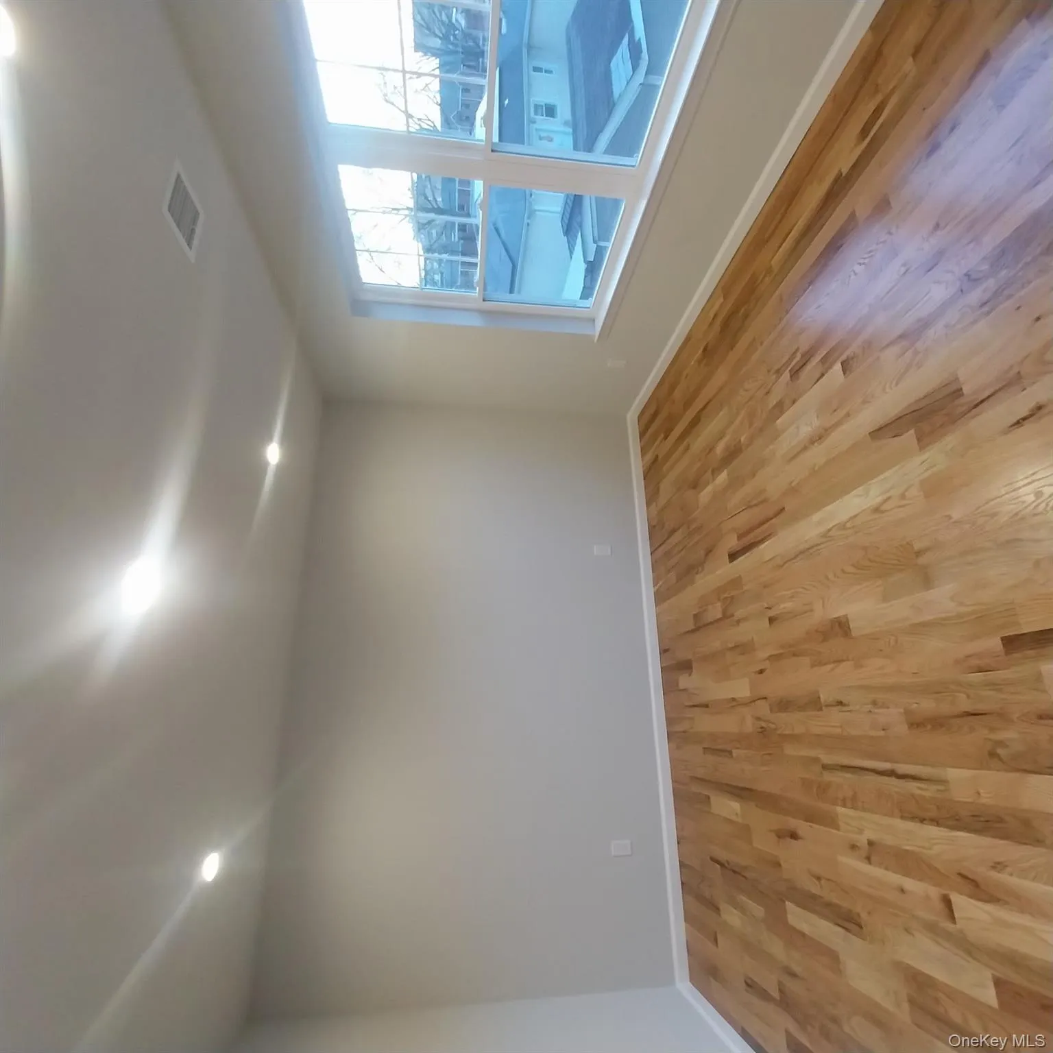 Unfurnished room featuring light wood-type flooring and recessed lighting Unfurnished room featuring light wood-type flooring and recessed lighting