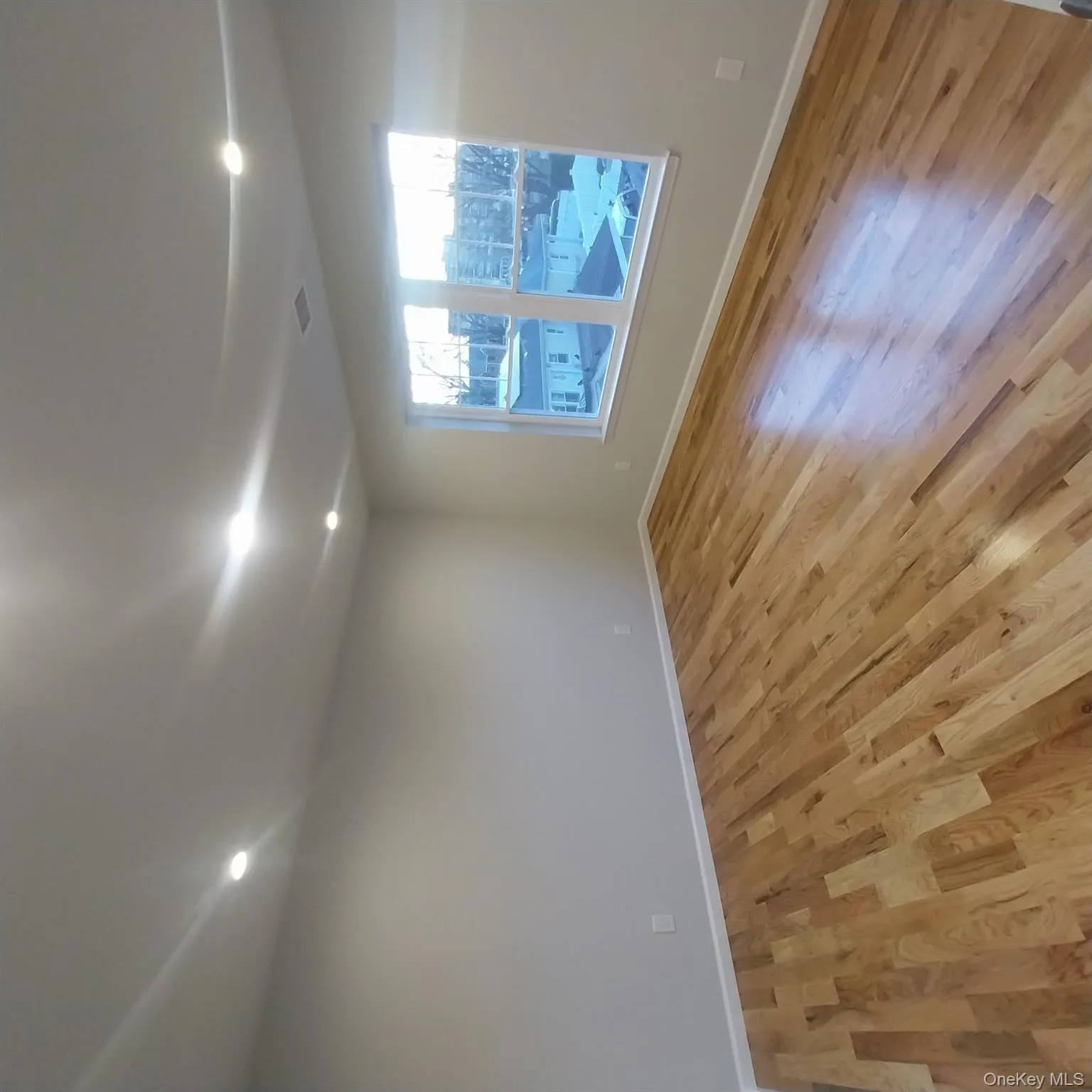 Spare room featuring light wood-type flooring and recessed lighting Spare room featuring light wood-type flooring and recessed lighting