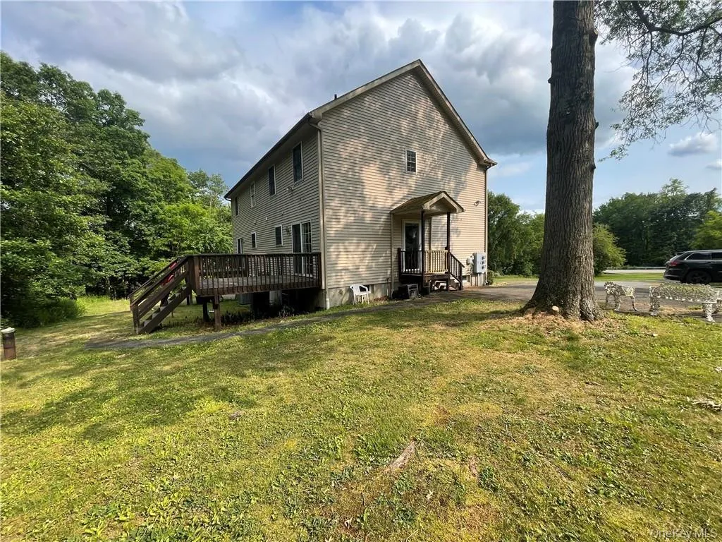 Back of property with a yard Back of property with a yard