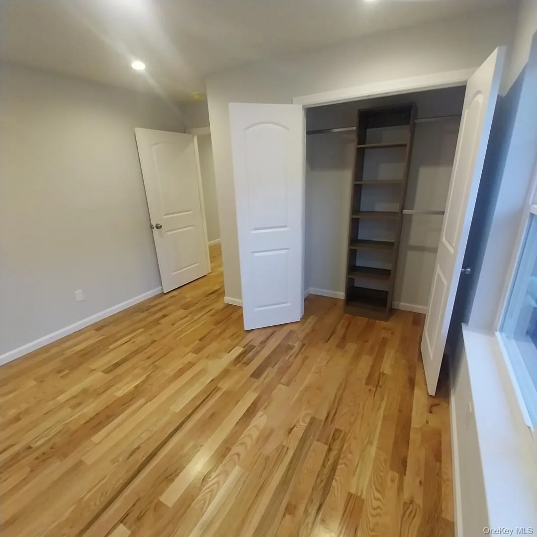 Unfurnished bedroom featuring light wood-type flooring, a closet, and recessed lighting Unfurnished bedroom featuring light wood-type flooring, a closet, and recessed lighting