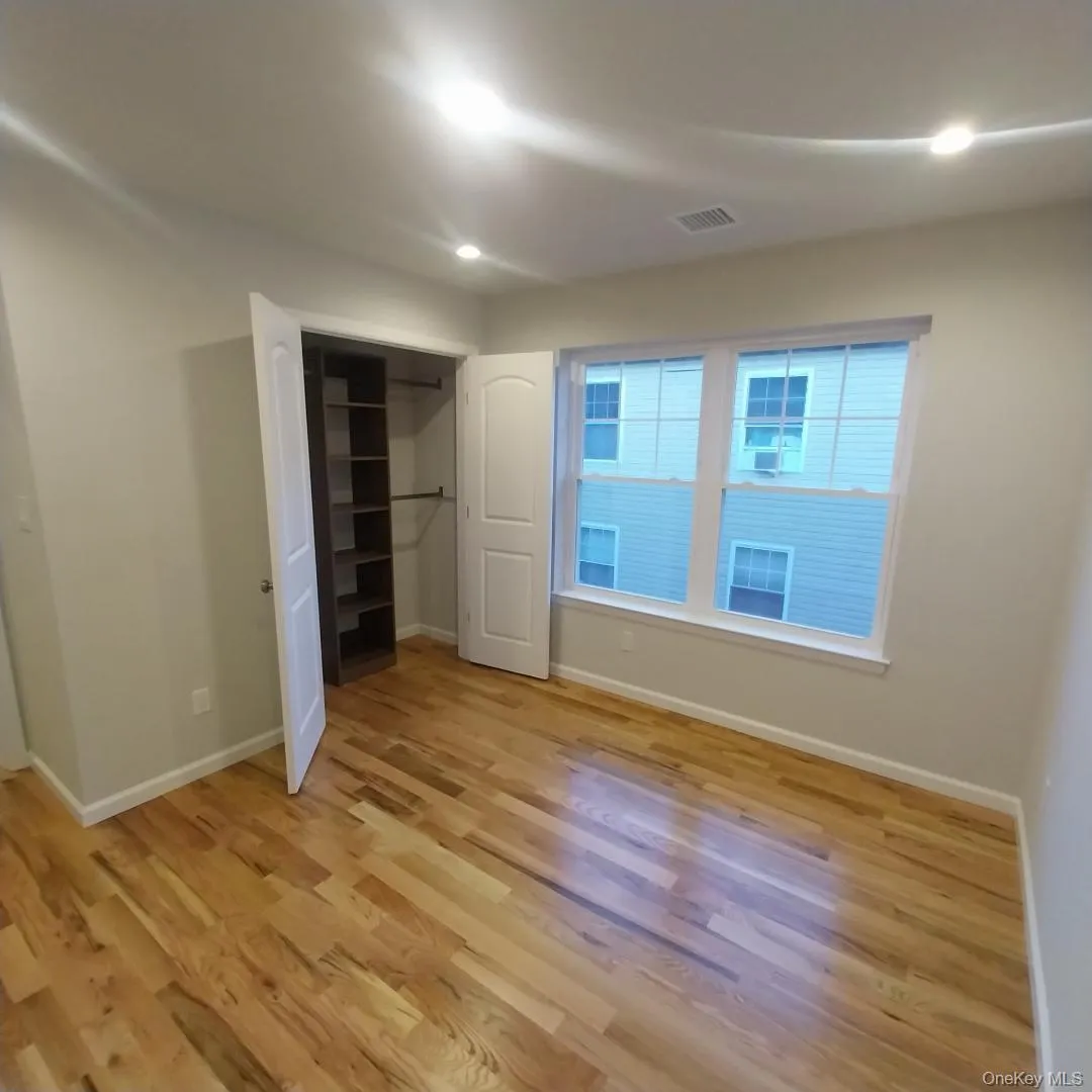 Unfurnished bedroom featuring light wood-style floors, recessed lighting, and a closet Unfurnished bedroom featuring light wood-style floors, recessed lighting, and a closet