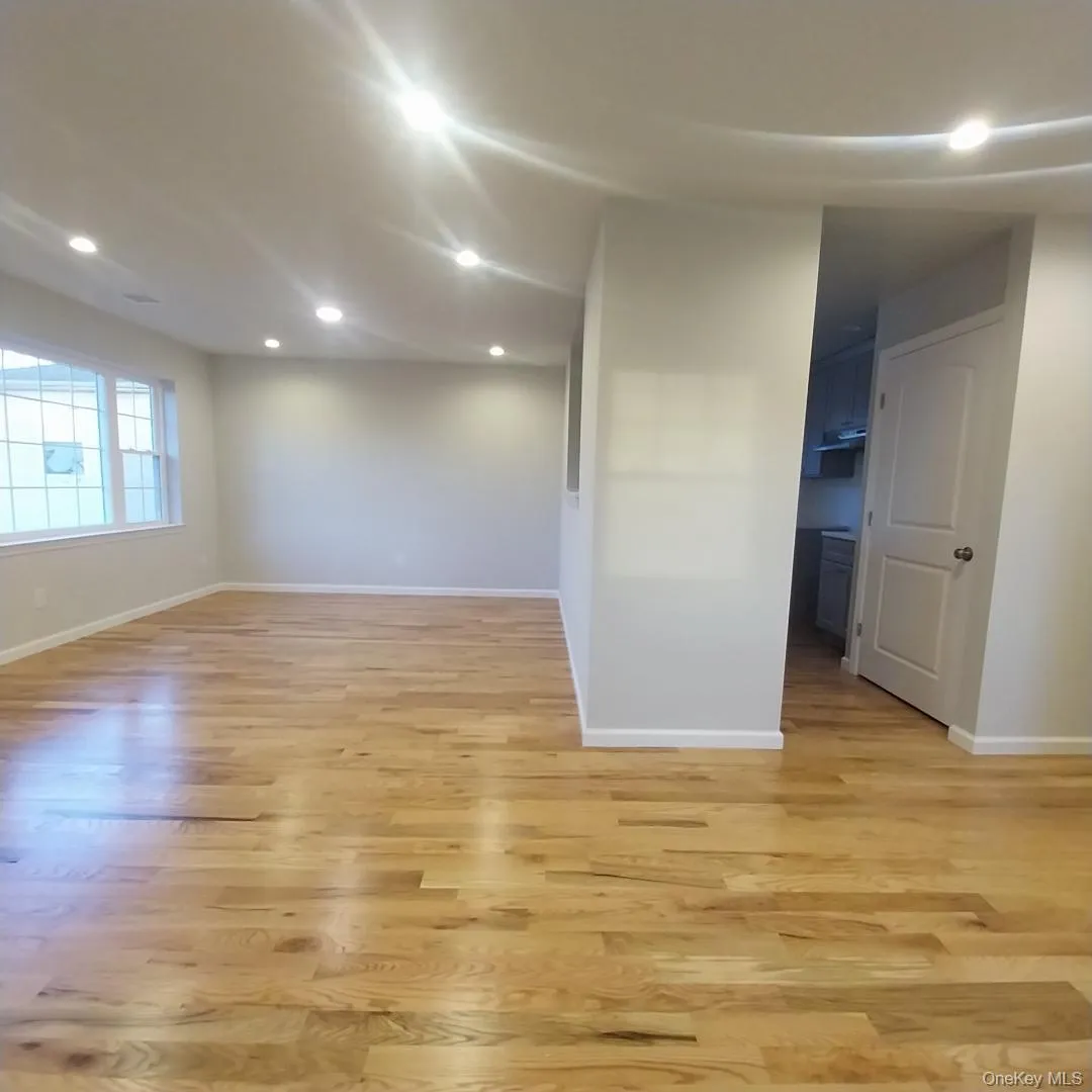 Empty room with recessed lighting and light wood-style flooring Empty room with recessed lighting and light wood-style flooring