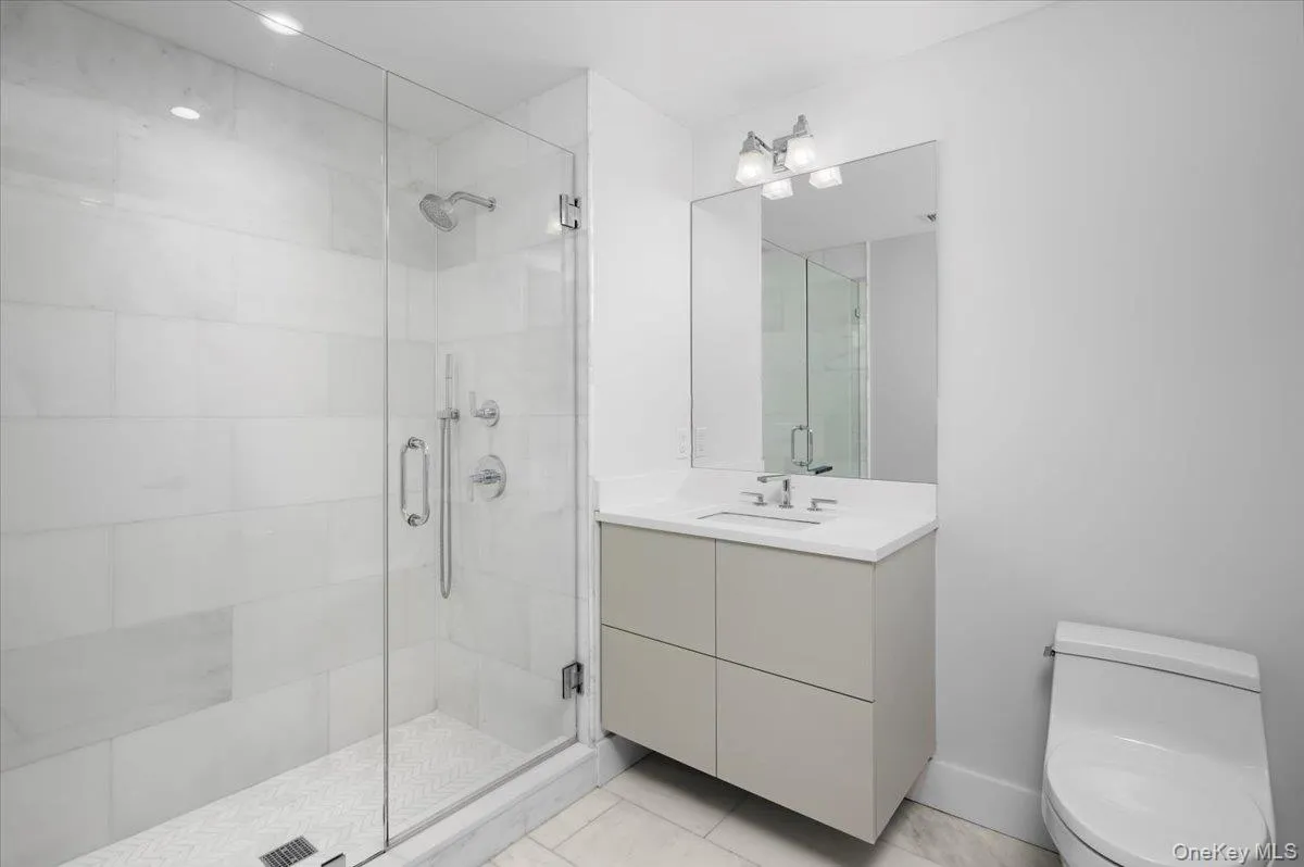 Full bathroom with vanity and a shower stall Full bathroom with vanity and a shower stall
