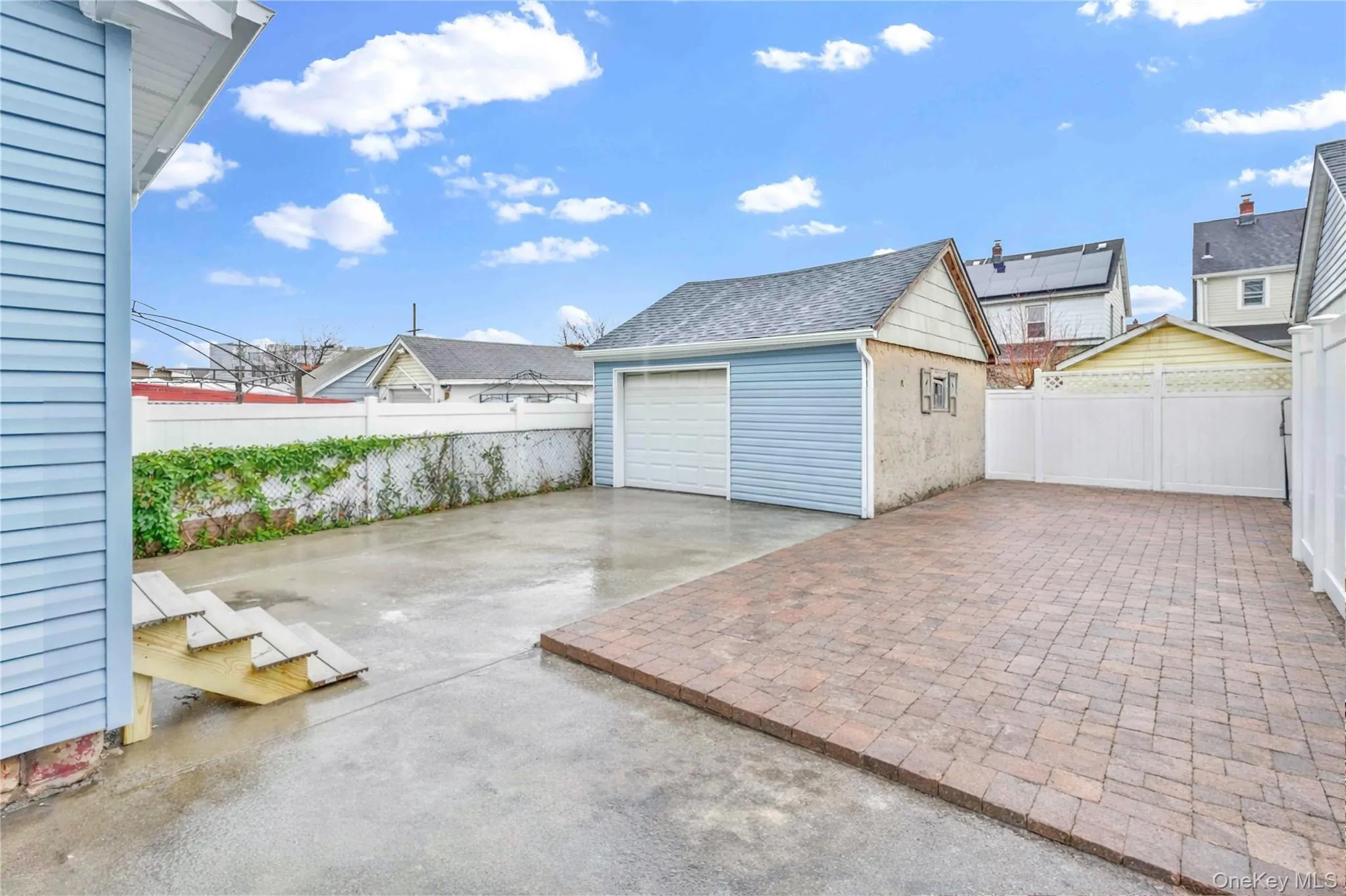 Garage featuring driveway Garage featuring driveway