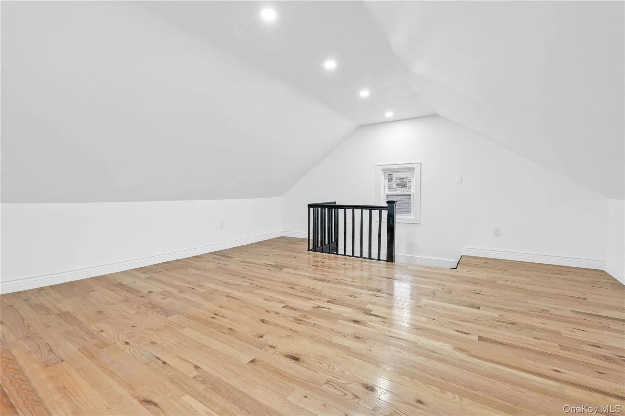 Bonus room featuring light wood finished floors, recessed lighting, and vaulted ceiling Bonus room featuring light wood finished floors, recessed lighting, and vaulted ceiling