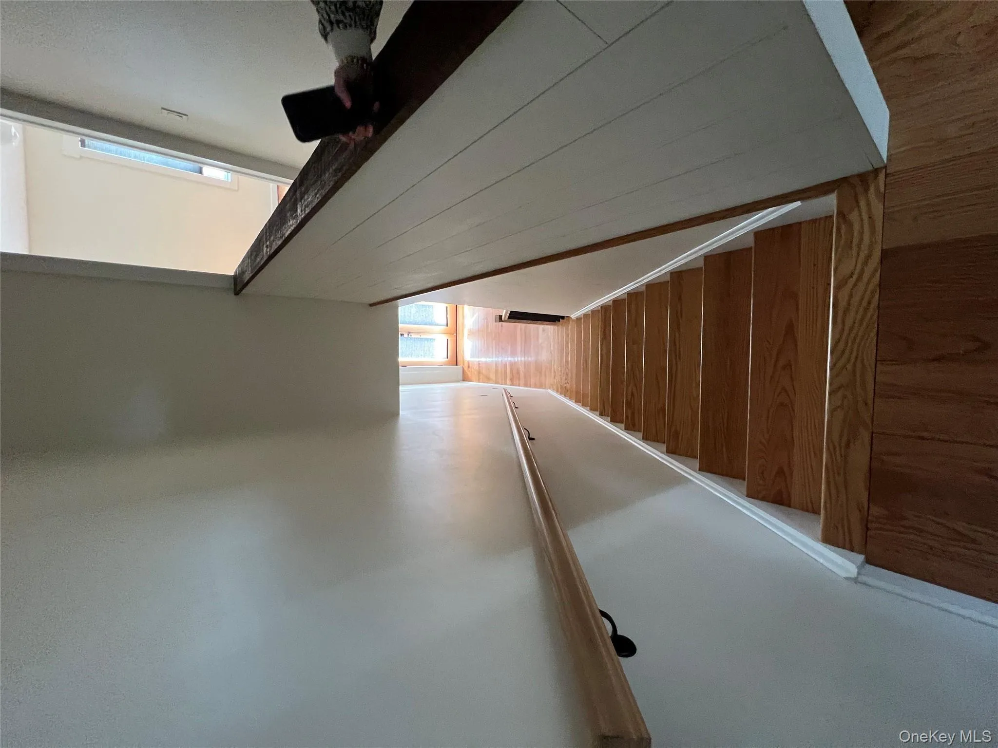 Stairway with baseboards and wood finished floors Stairway with baseboards and wood finished floors