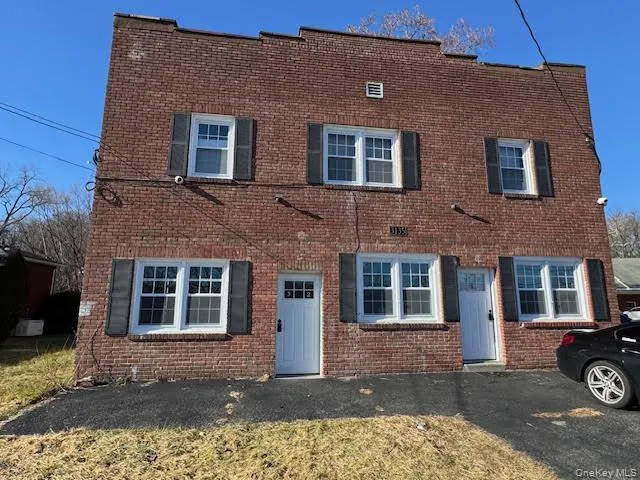Traditional-style house featuring brick siding Traditional-style house featuring brick siding