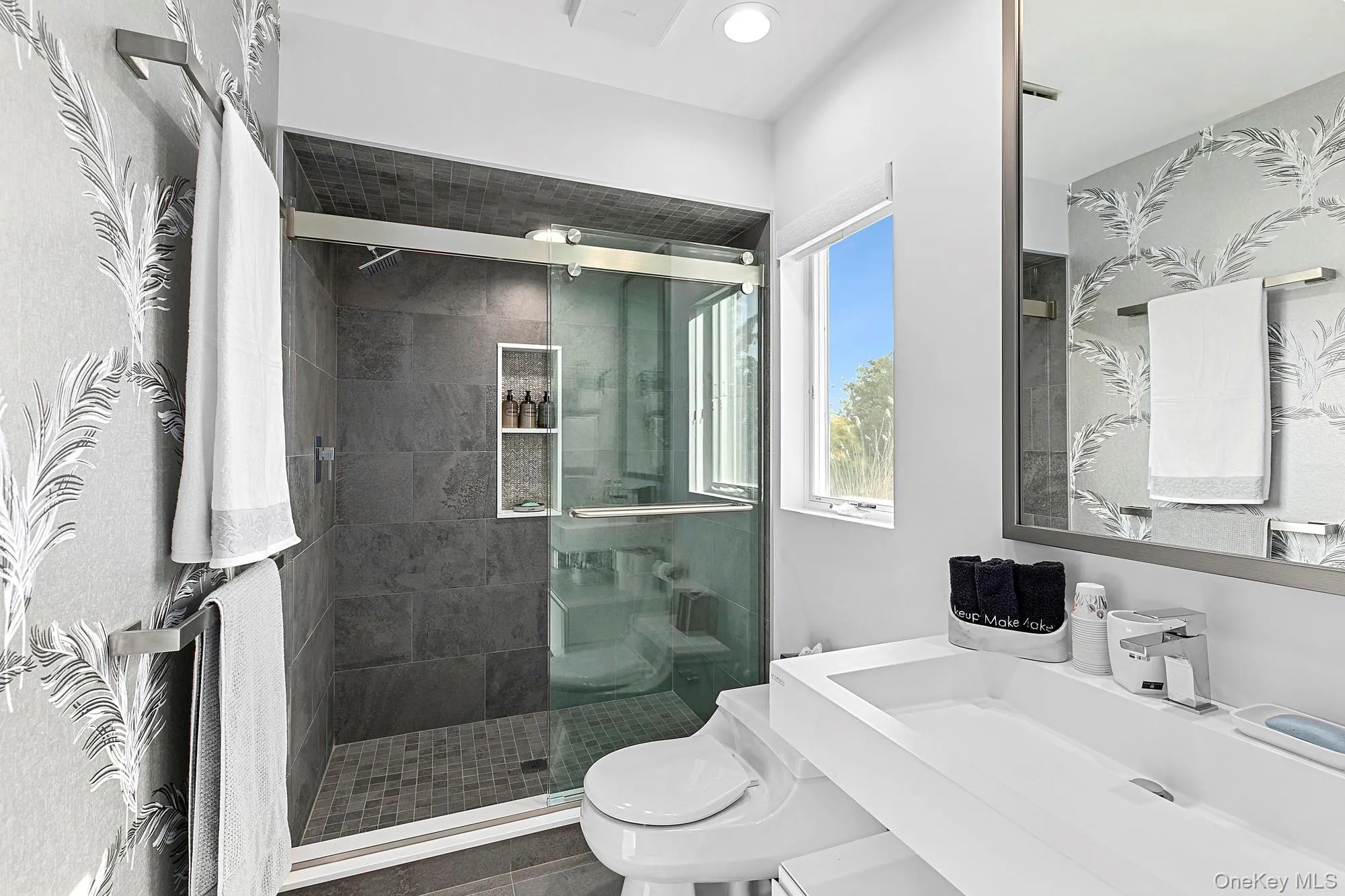 Bathroom with a stall shower and vanity Bathroom with a stall shower and vanity