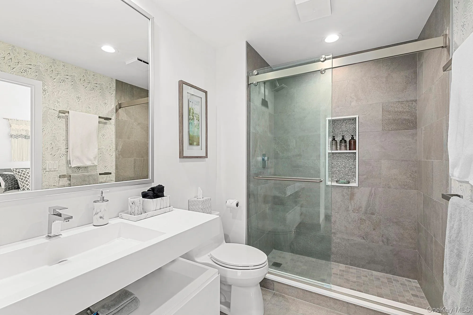 Bathroom with vanity, a shower stall, and recessed lighting Bathroom with vanity, a shower stall, and recessed lighting