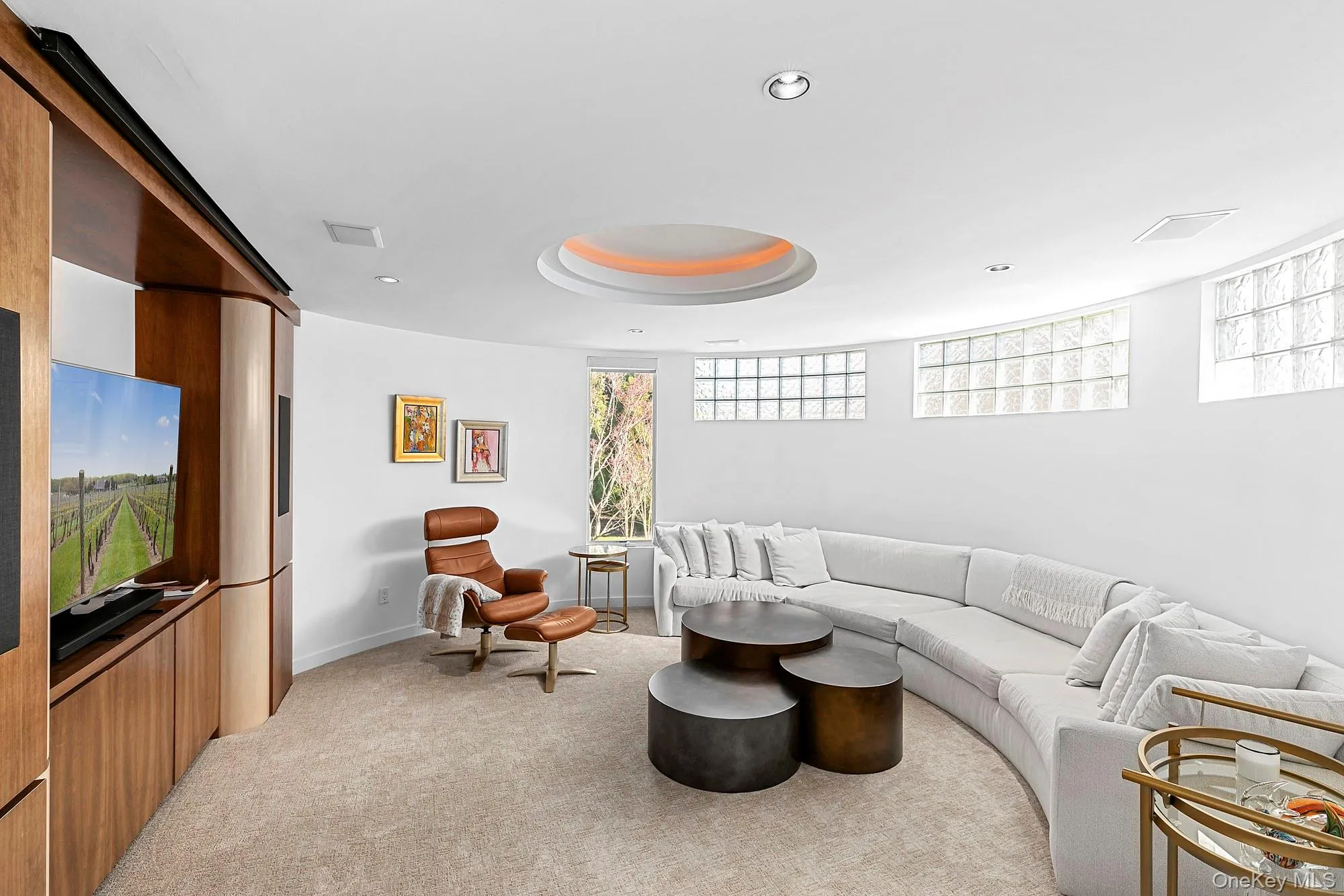 Living room with light carpet and recessed lighting Living room with light carpet and recessed lighting