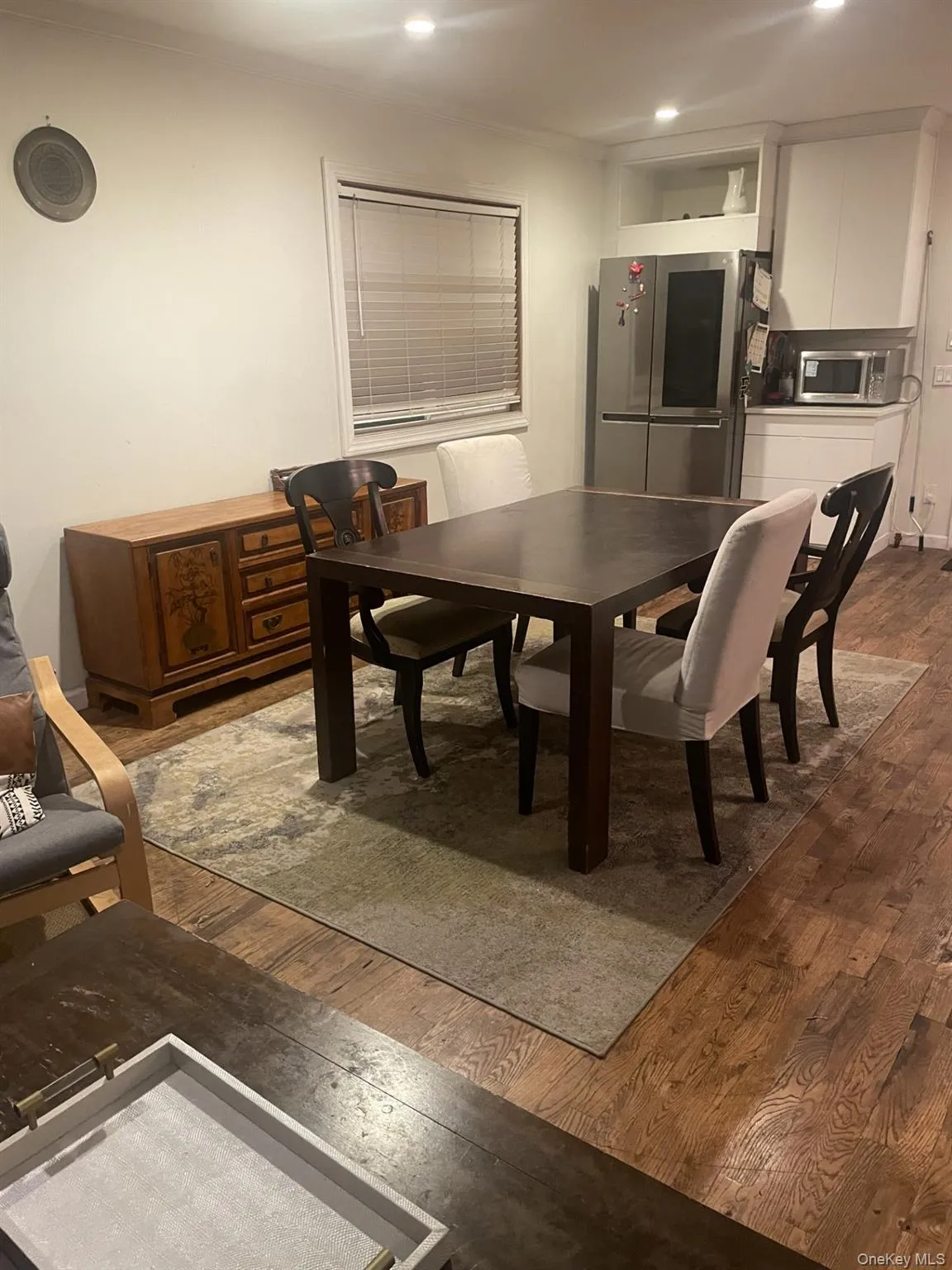 Dining space with dark wood-style floors and recessed lighting Dining space with dark wood-style floors and recessed lighting