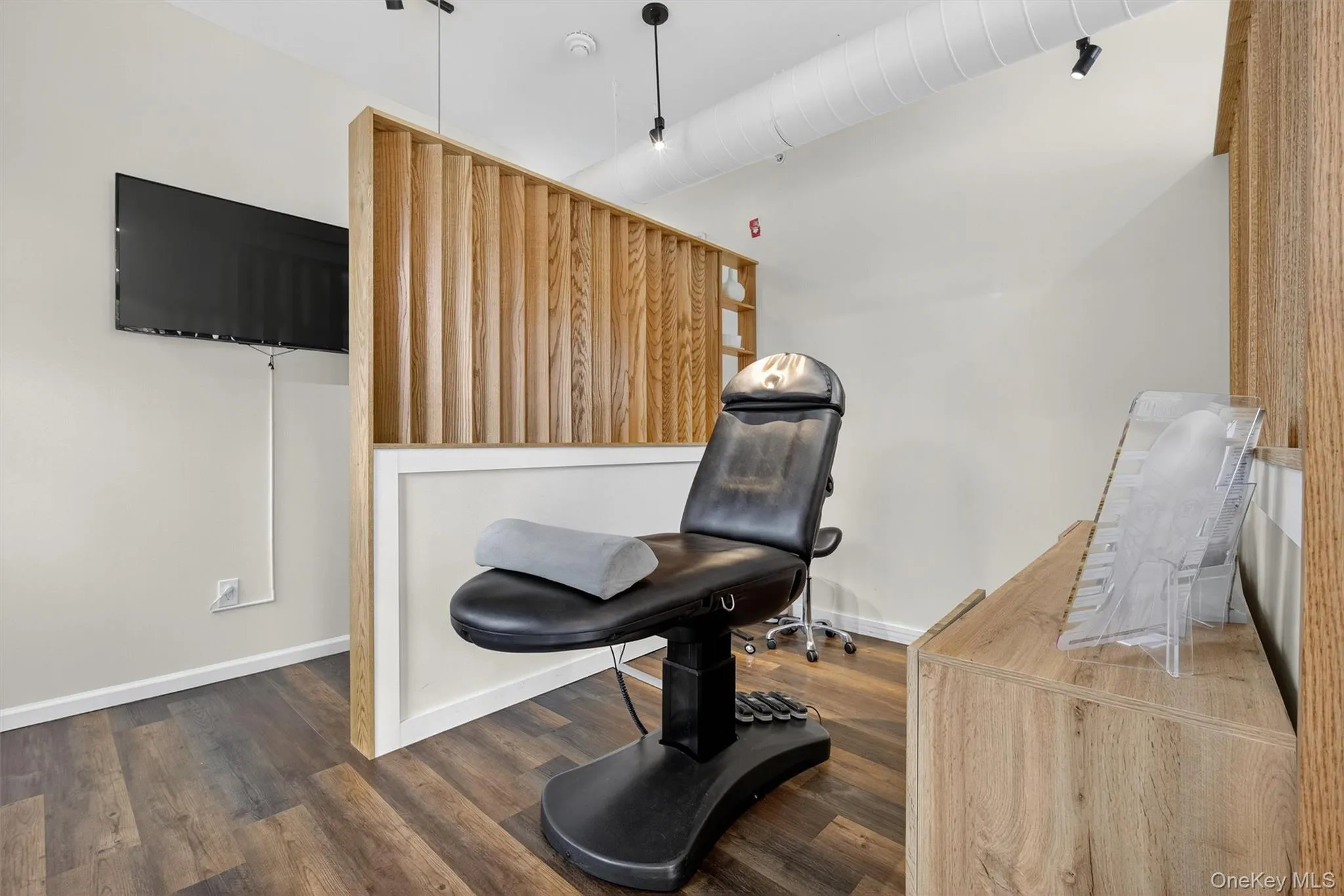 Sitting room featuring wood finished floors and baseboards Sitting room featuring wood finished floors and baseboards