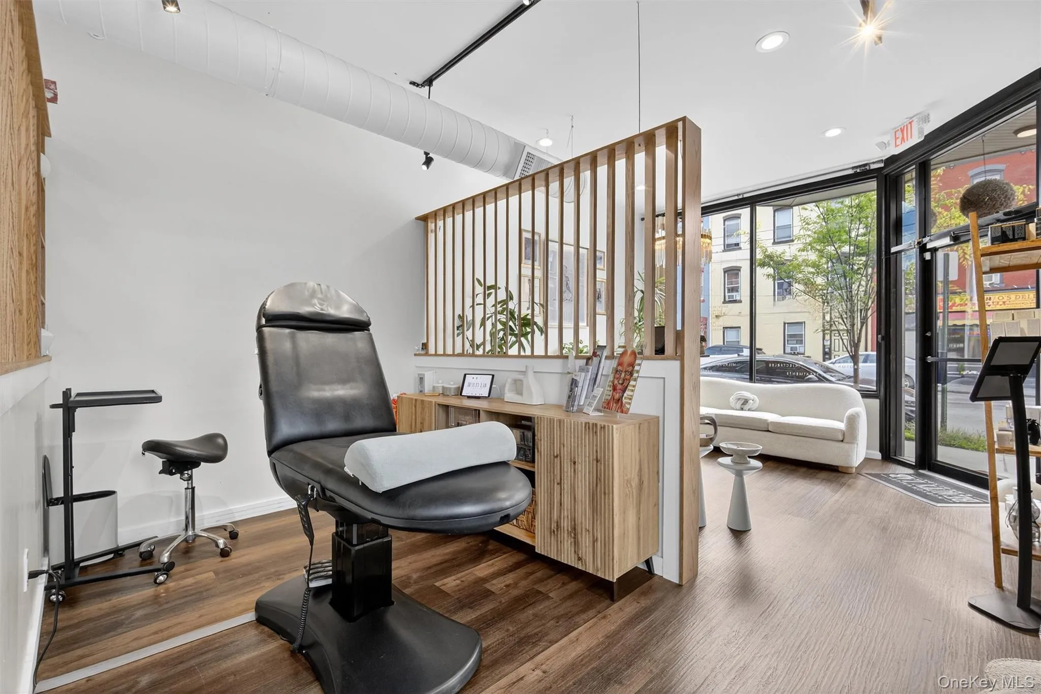 Sitting room featuring expansive windows and recessed lighting Sitting room featuring expansive windows and recessed lighting