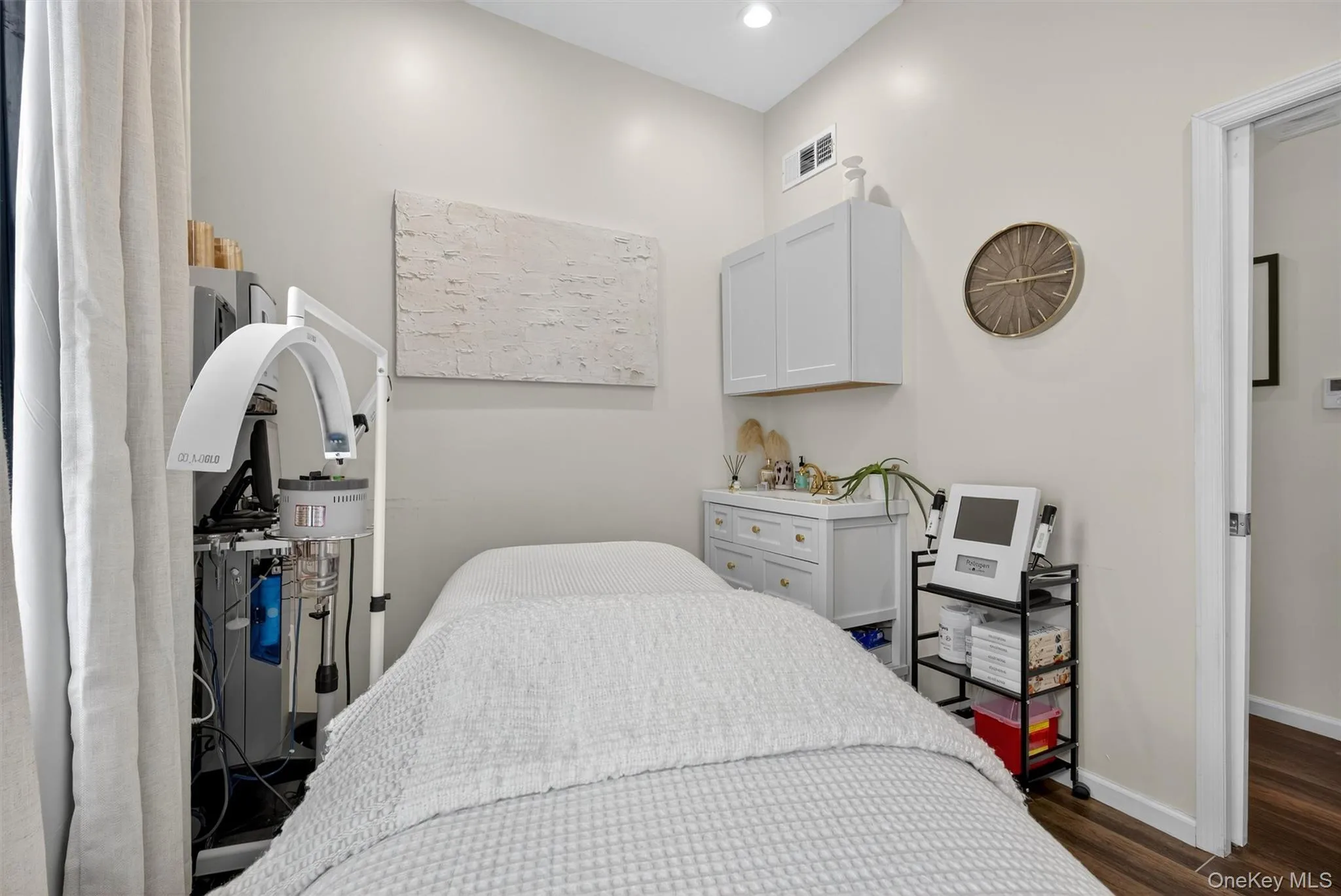 Bedroom with dark wood finished floors and recessed lighting Bedroom with dark wood finished floors and recessed lighting