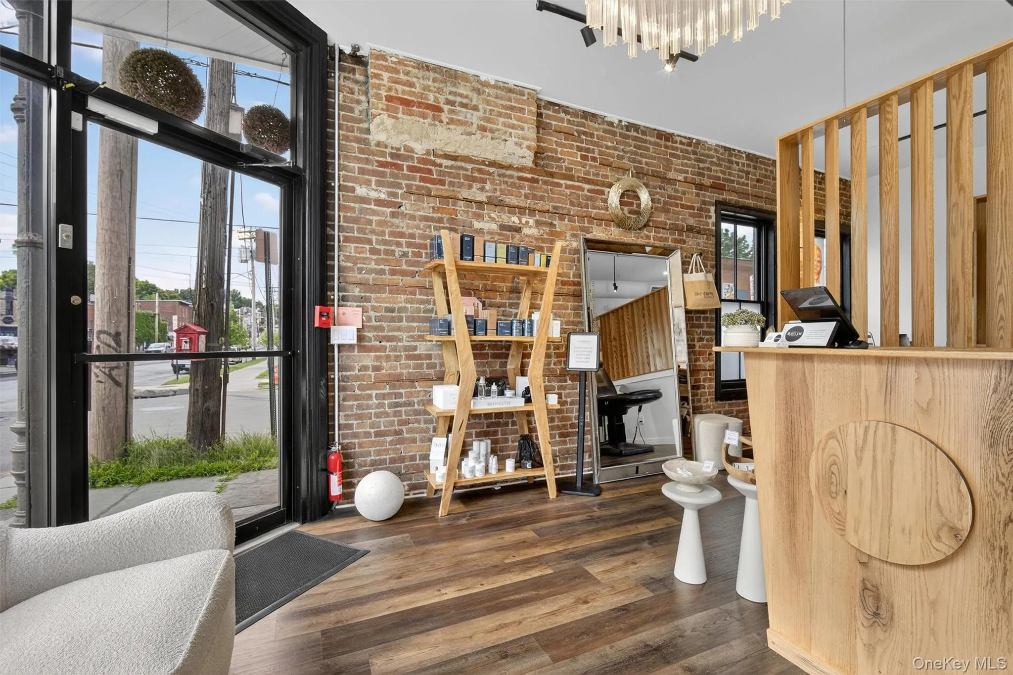 Welcome area featuring brick wall Welcome area featuring brick wall