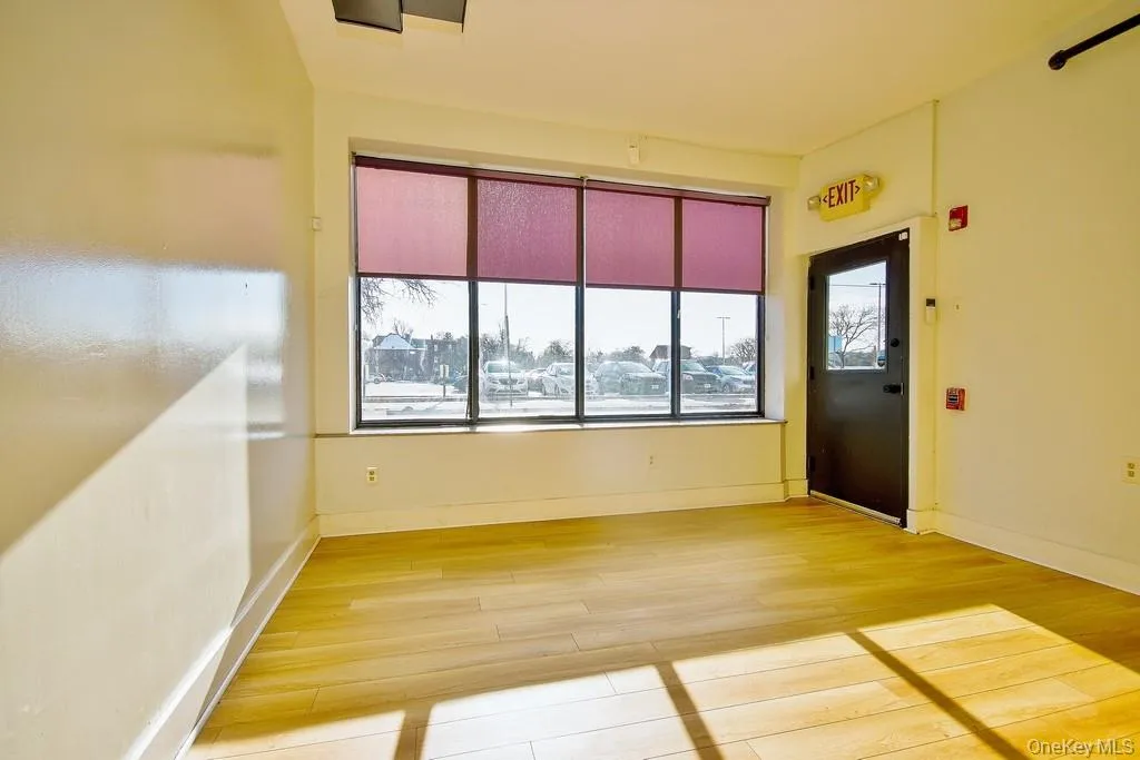 Spare room featuring light wood finished floors and baseboards Spare room featuring light wood finished floors and baseboards