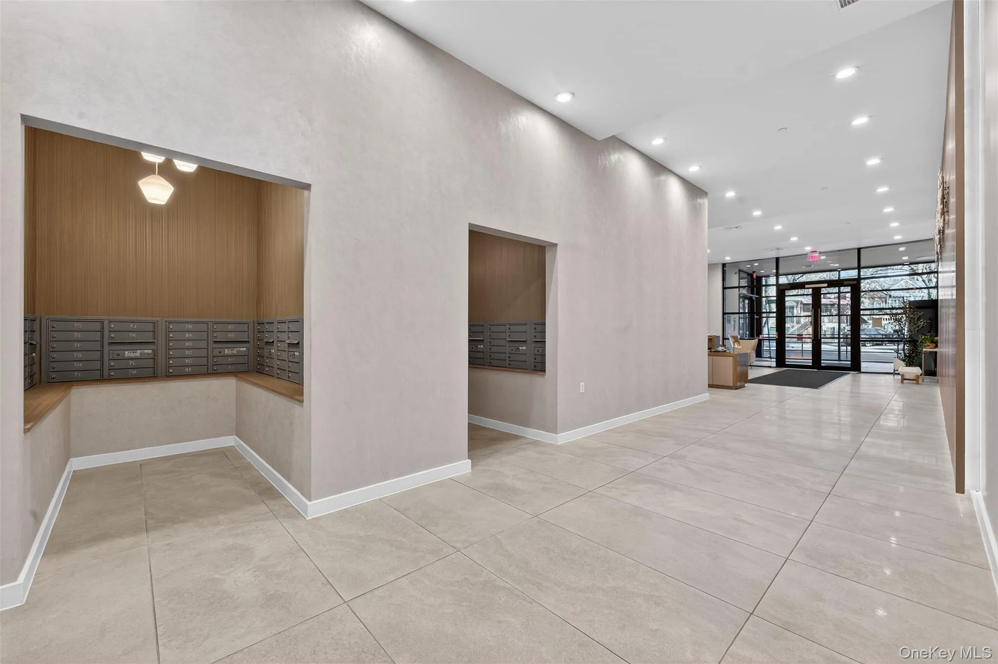 Community lobby featuring recessed lighting and a wall of windows Community lobby featuring recessed lighting and a wall of windows