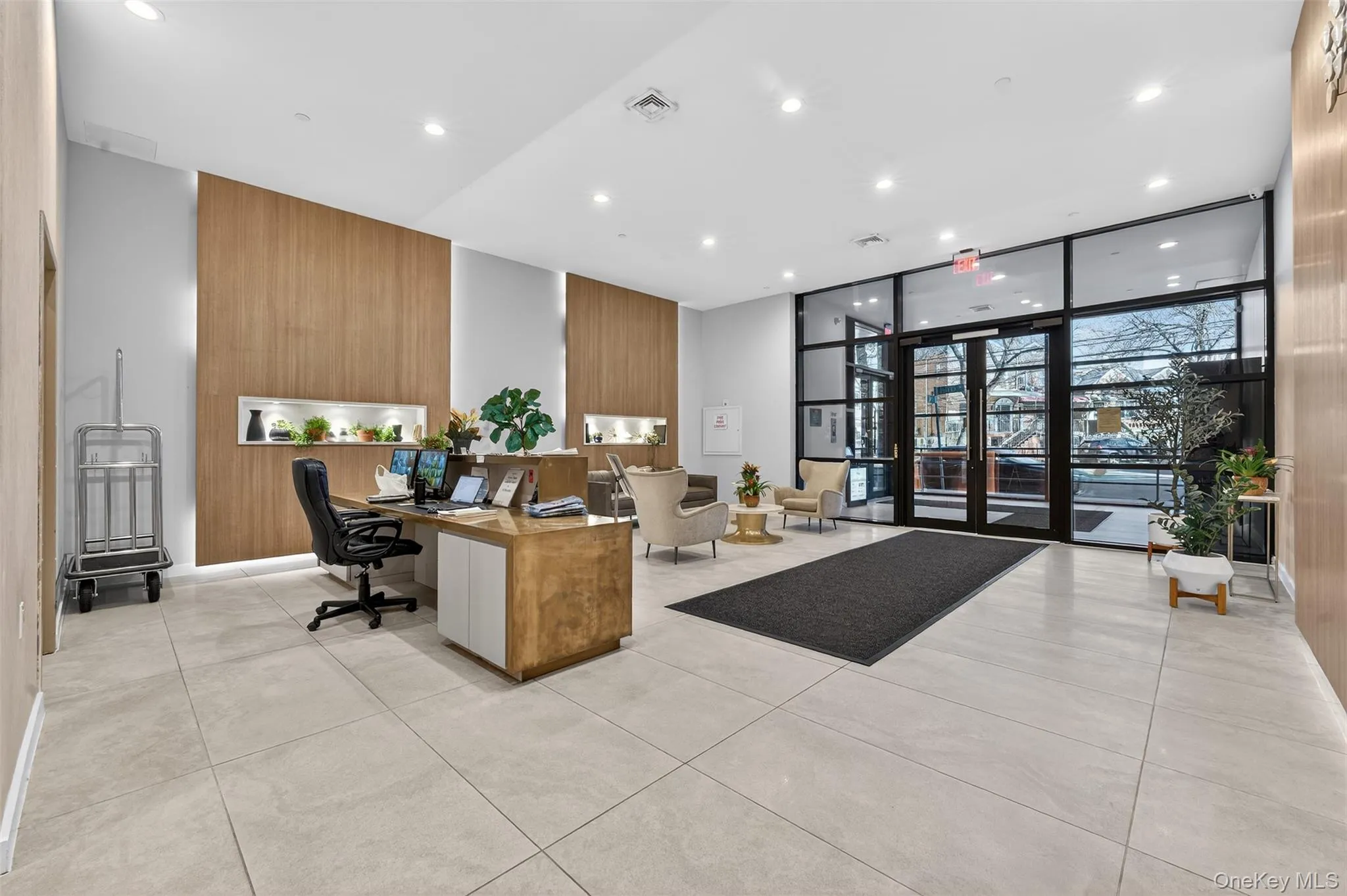 Lobby with recessed lighting and a wall of windows Lobby with recessed lighting and a wall of windows