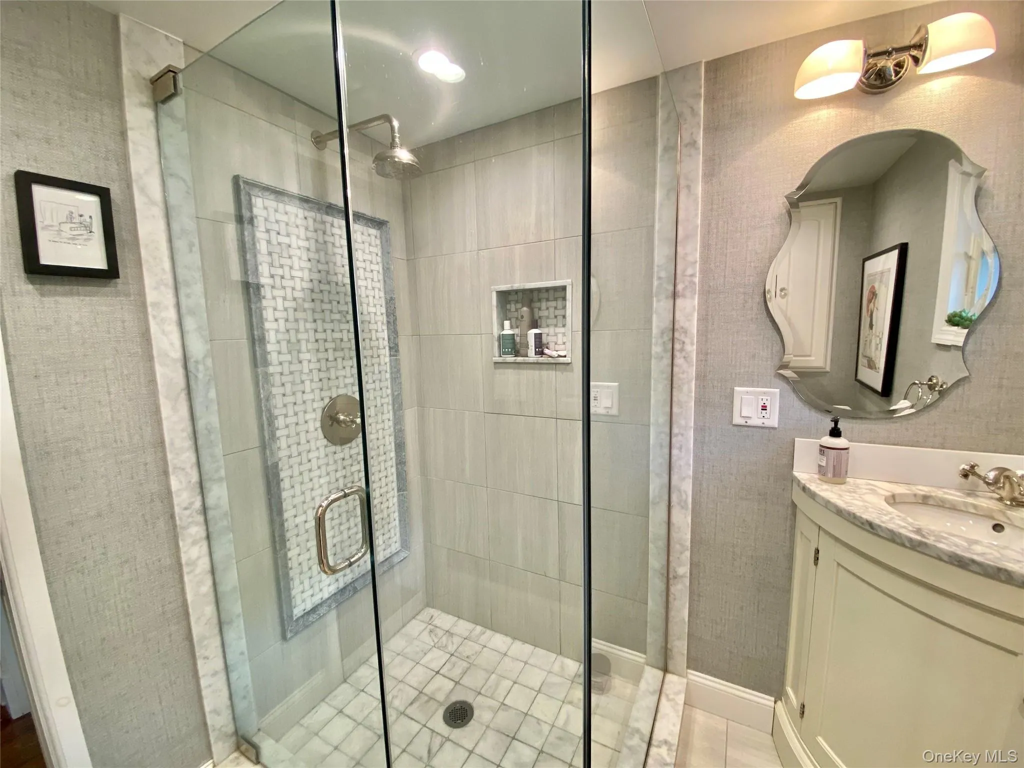 Bathroom featuring vanity, tile patterned floors, and a shower with door Bathroom featuring vanity, tile patterned floors, and a shower with door