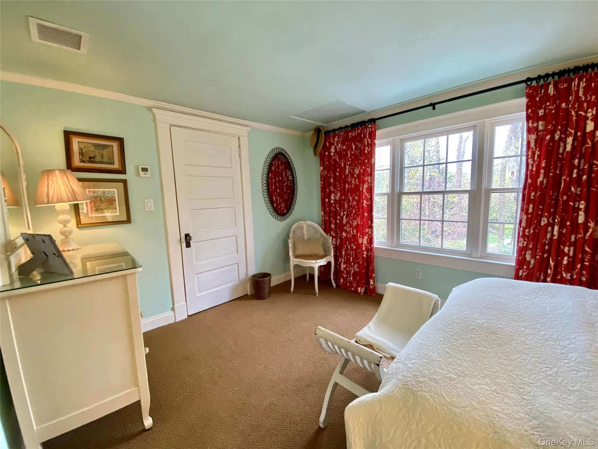 Carpeted bedroom featuring crown molding Carpeted bedroom featuring crown molding