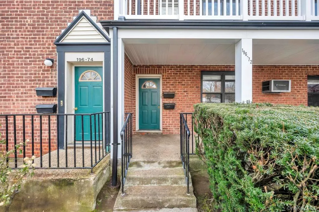 Property entrance featuring brick siding Property entrance featuring brick siding