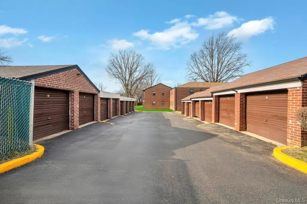 Garage featuring a residential view Garage featuring a residential view