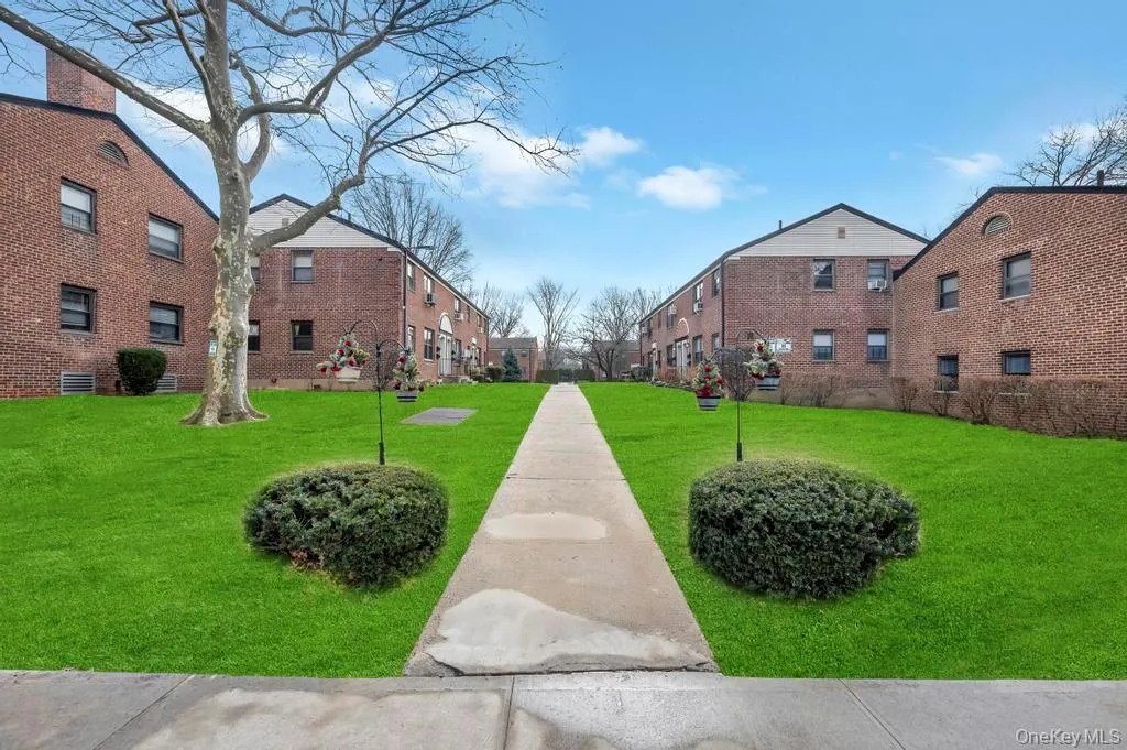 View of home's community with a lawn View of home's community with a lawn