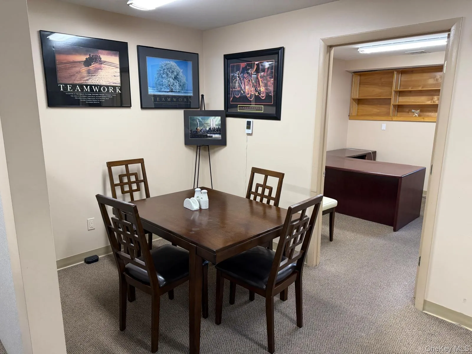 Dining space featuring light carpet and baseboards Dining space featuring light carpet and baseboards