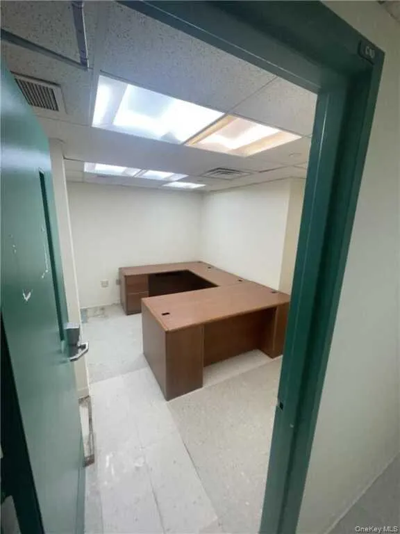 Unfurnished office featuring a drop ceiling Unfurnished office featuring a drop ceiling