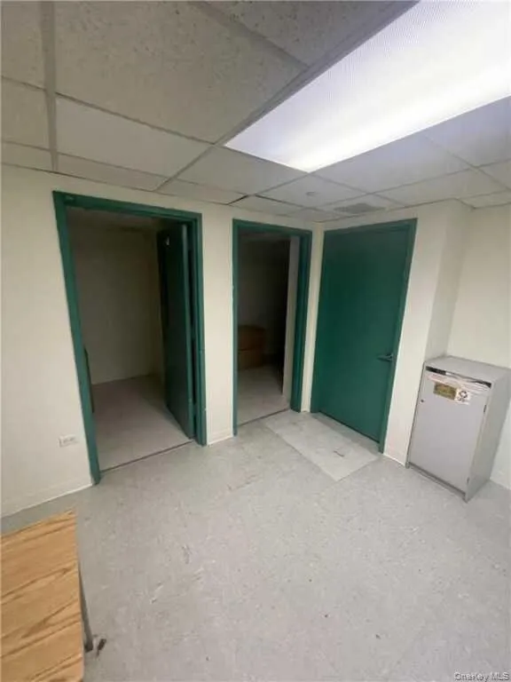 Finished below grade area with a paneled ceiling Finished below grade area with a paneled ceiling