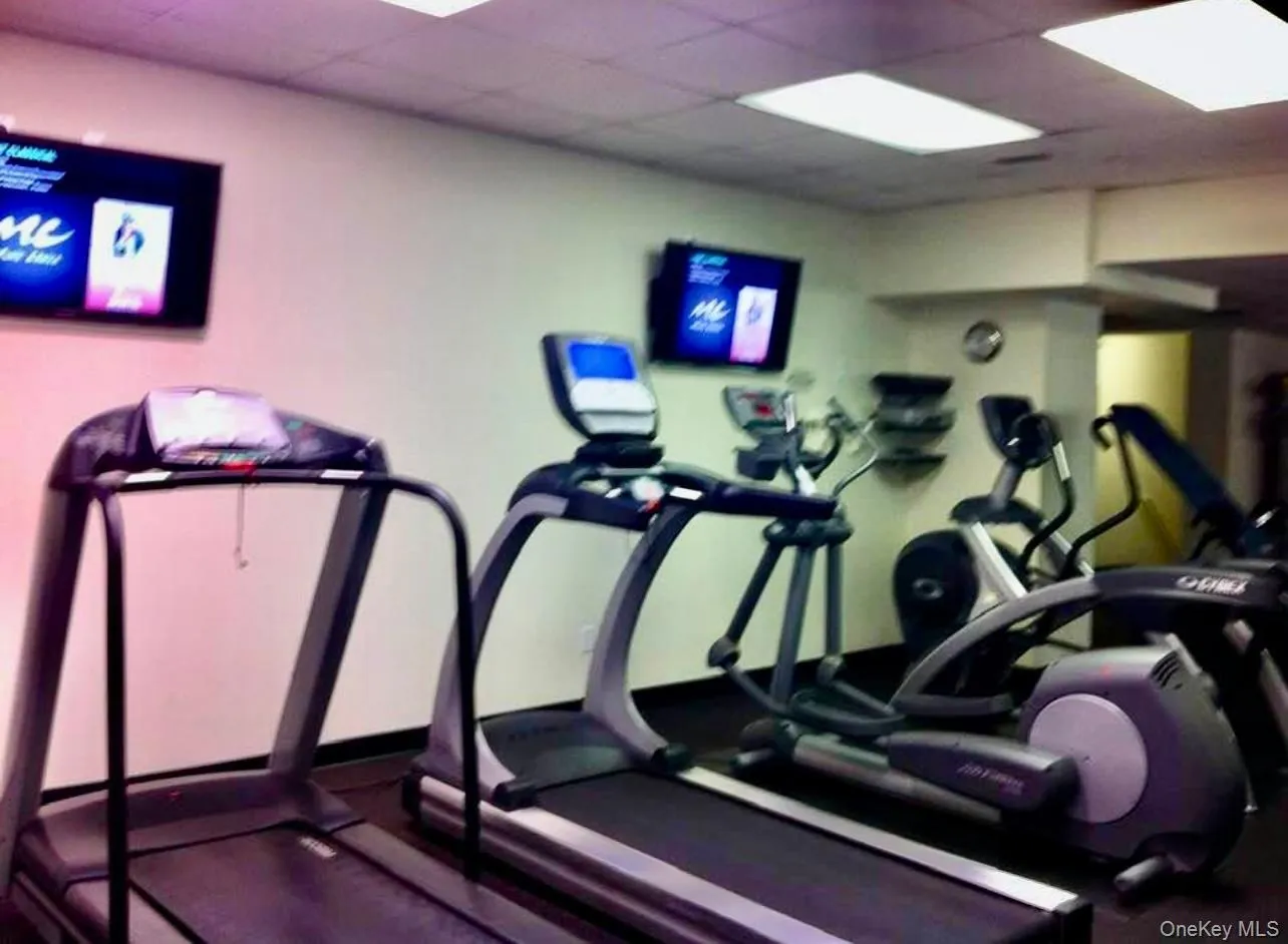 Gym with a paneled ceiling Gym with a paneled ceiling