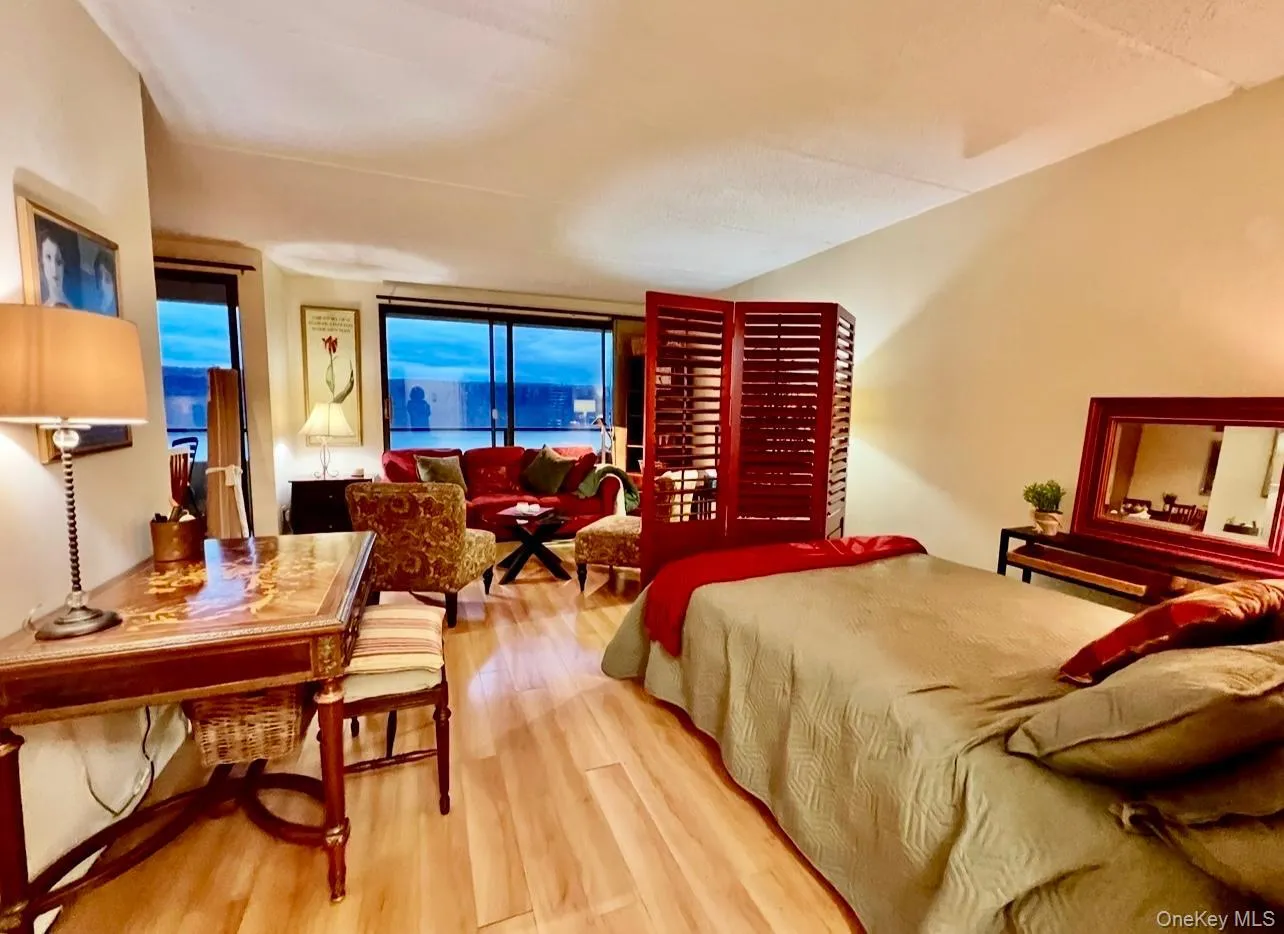 Bedroom featuring wood finished floors Bedroom featuring wood finished floors