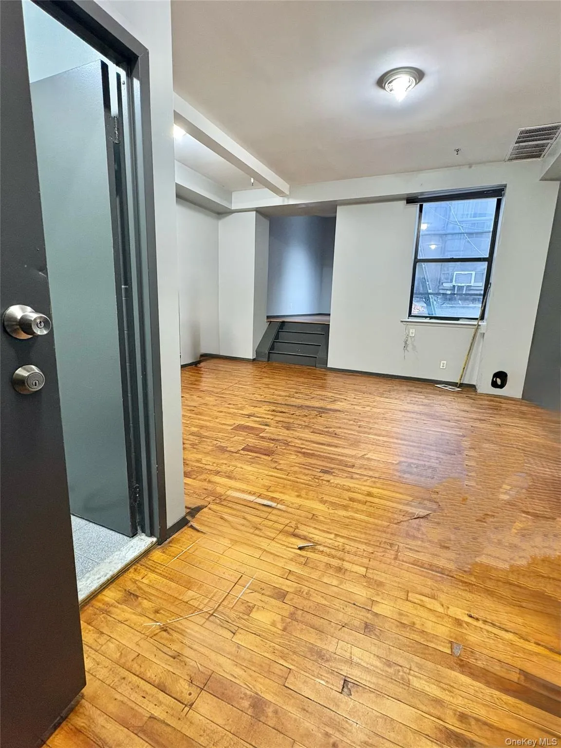 Spare room featuring light wood-style floors Spare room featuring light wood-style floors