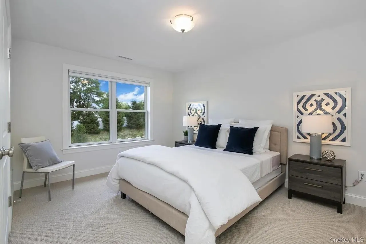 Carpeted bedroom with baseboards Carpeted bedroom with baseboards