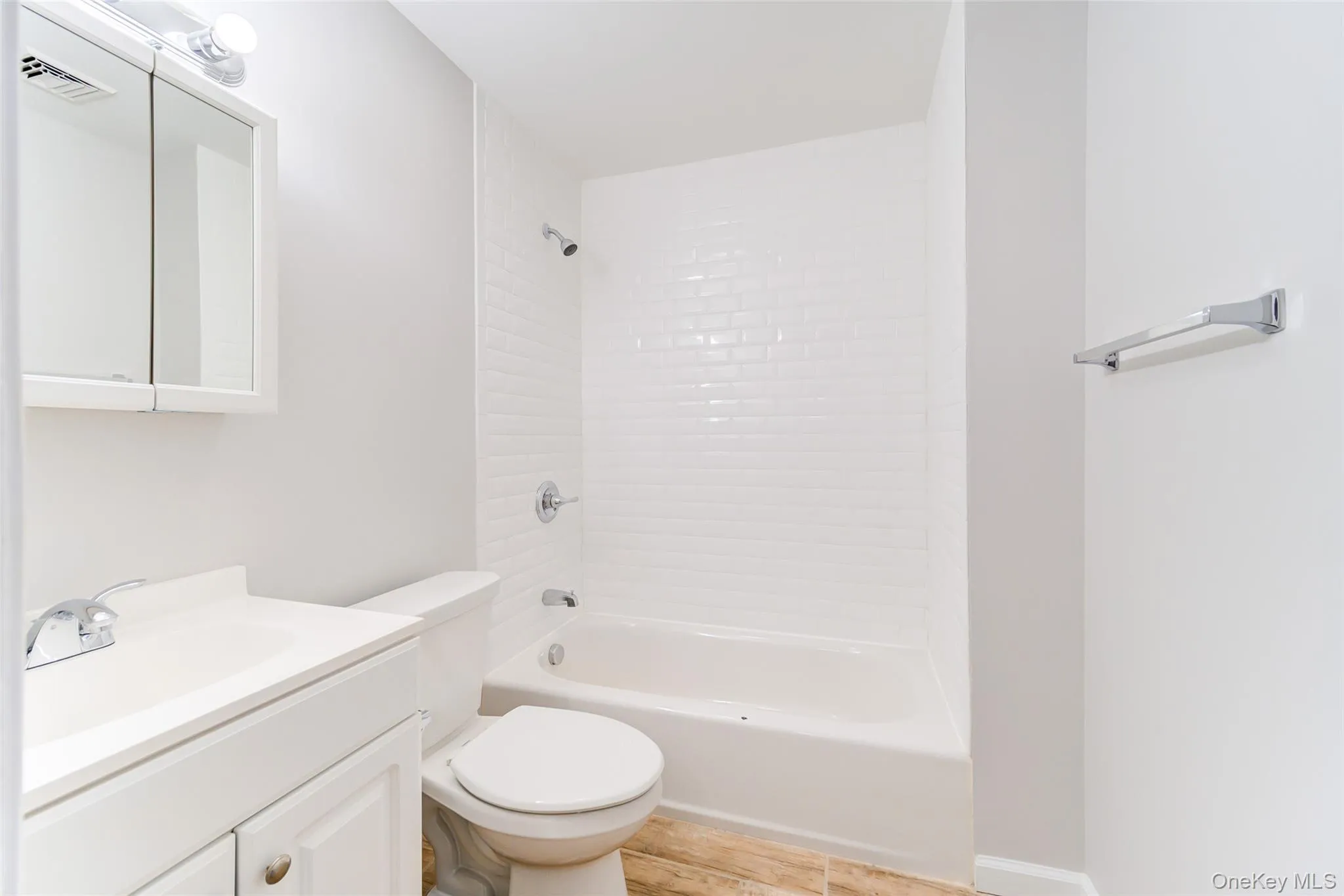 Full bath featuring vanity and shower combination Full bath featuring vanity and shower combination