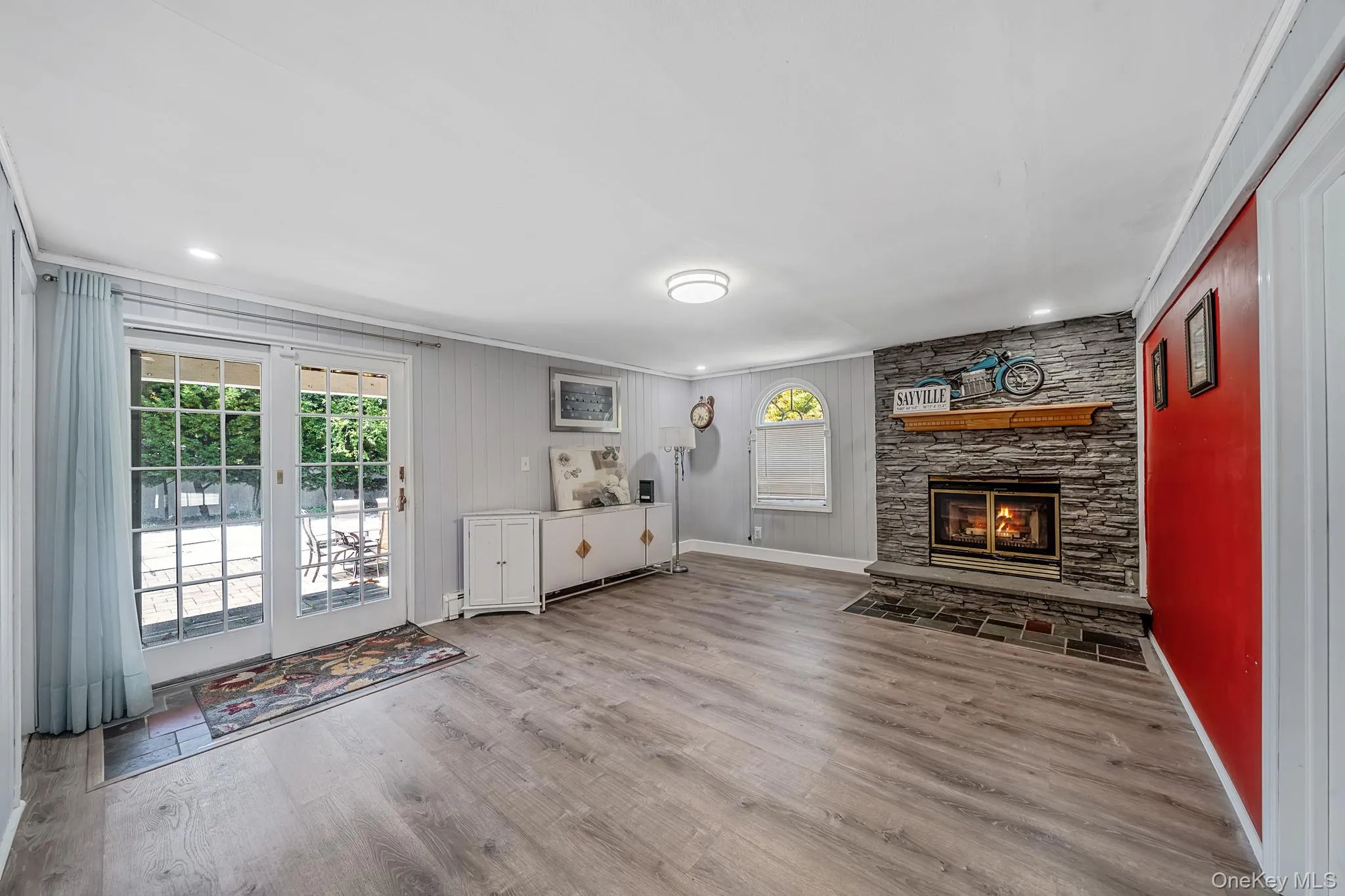 Lower Level Family Room/Den with Fireplace Lower Level Family Room/Den with Fireplace