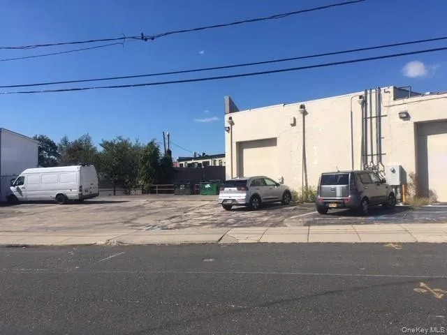Private Lot behind building with rear entrance Private Lot behind building with rear entrance