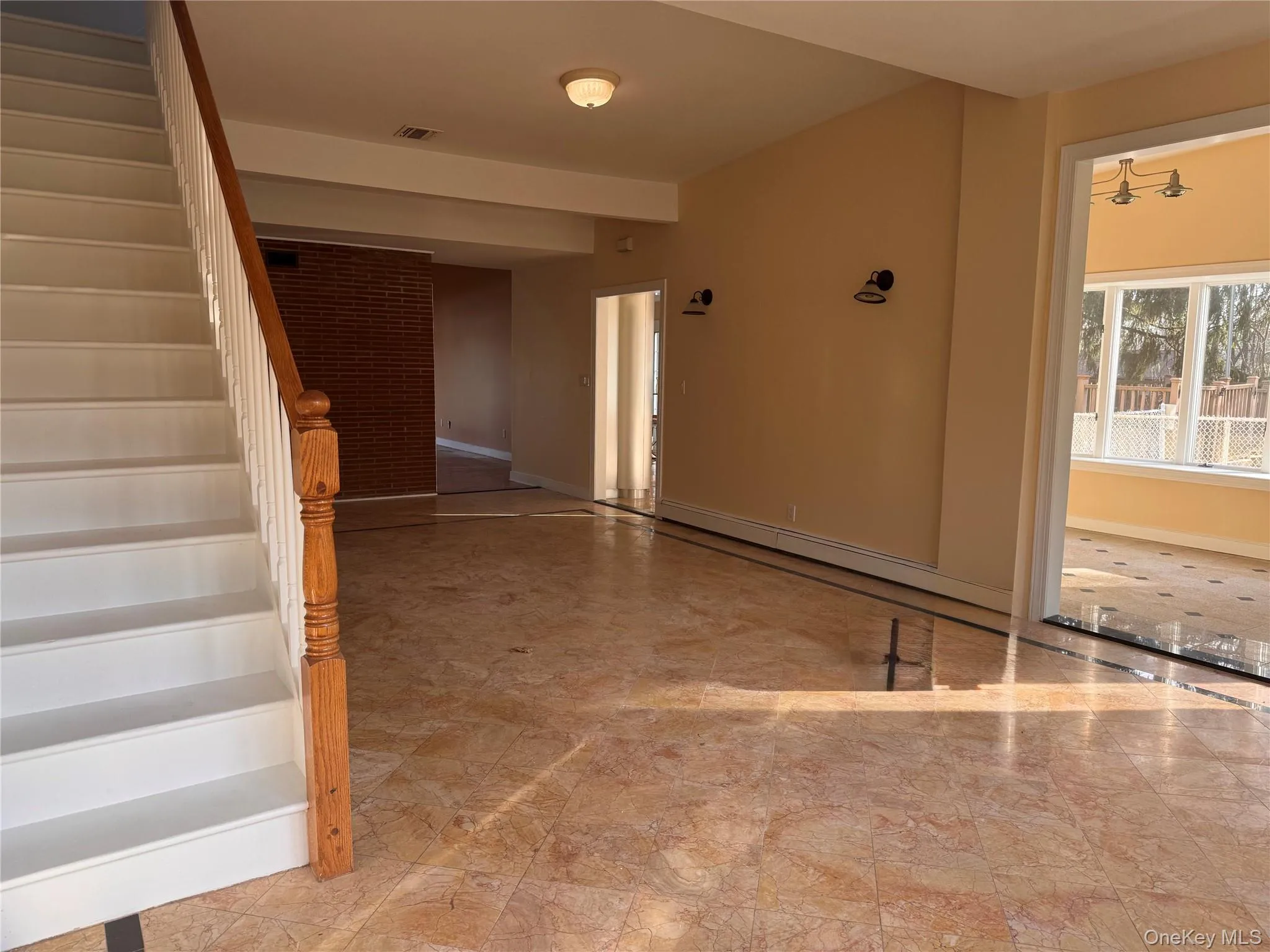 Stairway featuring baseboards Stairway featuring baseboards