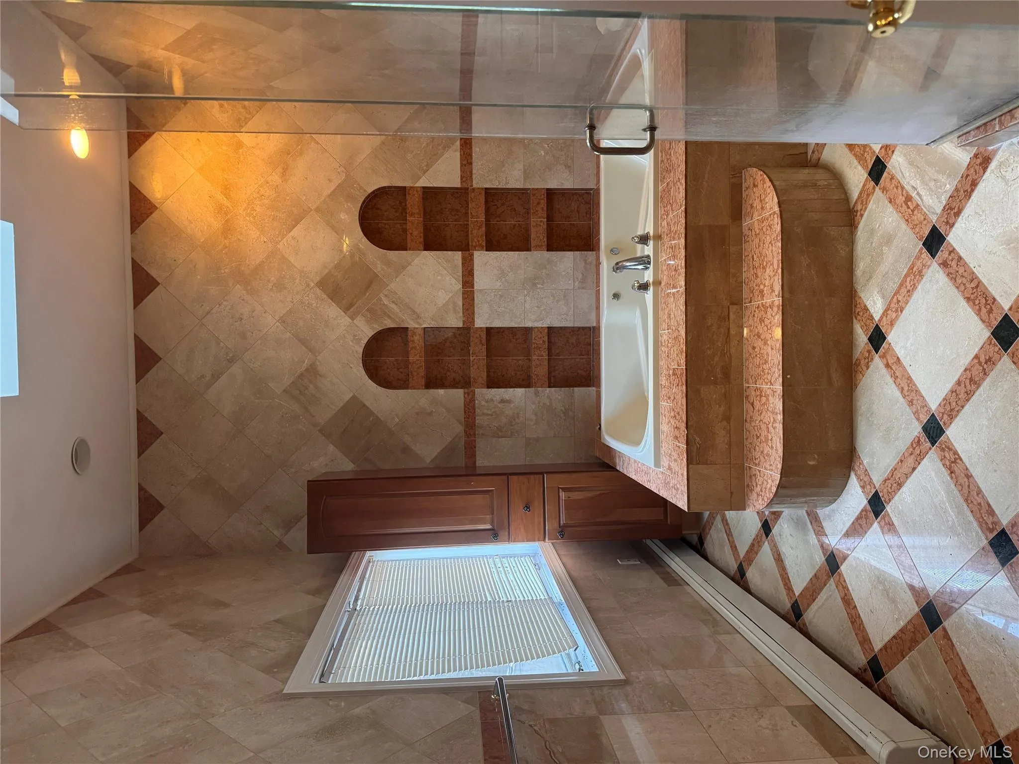Bathroom featuring baseboard heating, tile walls, a garden tub, a skylight, and recessed lighting Bathroom featuring baseboard heating, tile walls, a garden tub, a skylight, and recessed lighting
